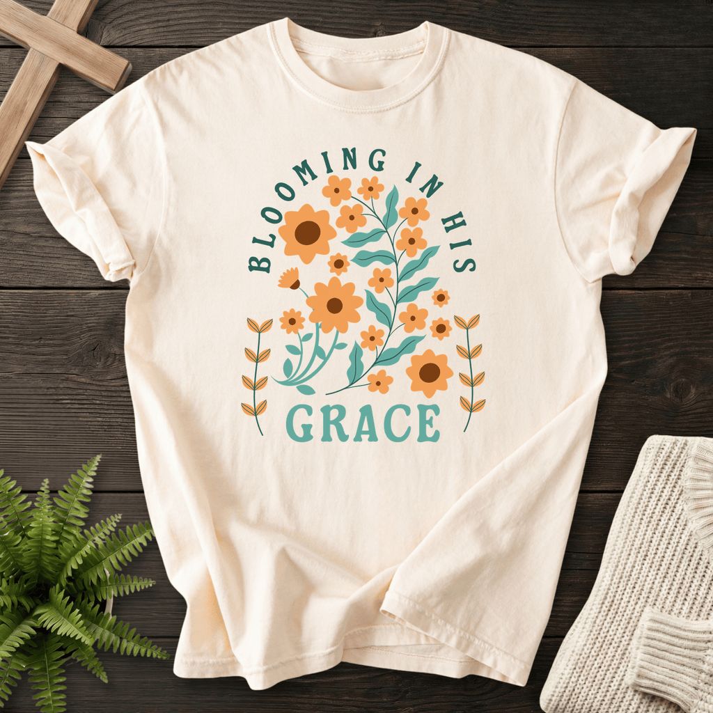 Ivory Christian t-shirt for women with a retro orange sunflower botanical design and teal lettering.