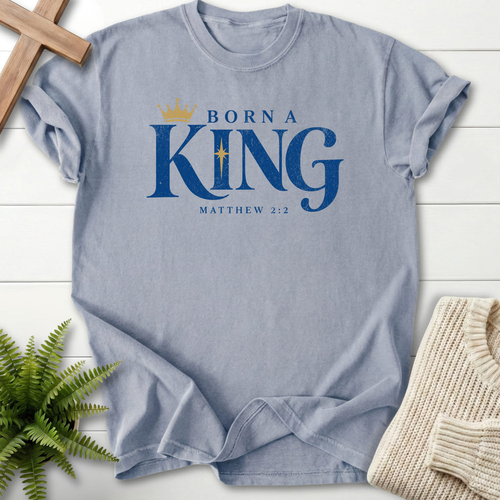 Flatlay of a Granite Bible verse tee with "Born a King T-Shirt" Matthew 2:2 For faith wear collections.