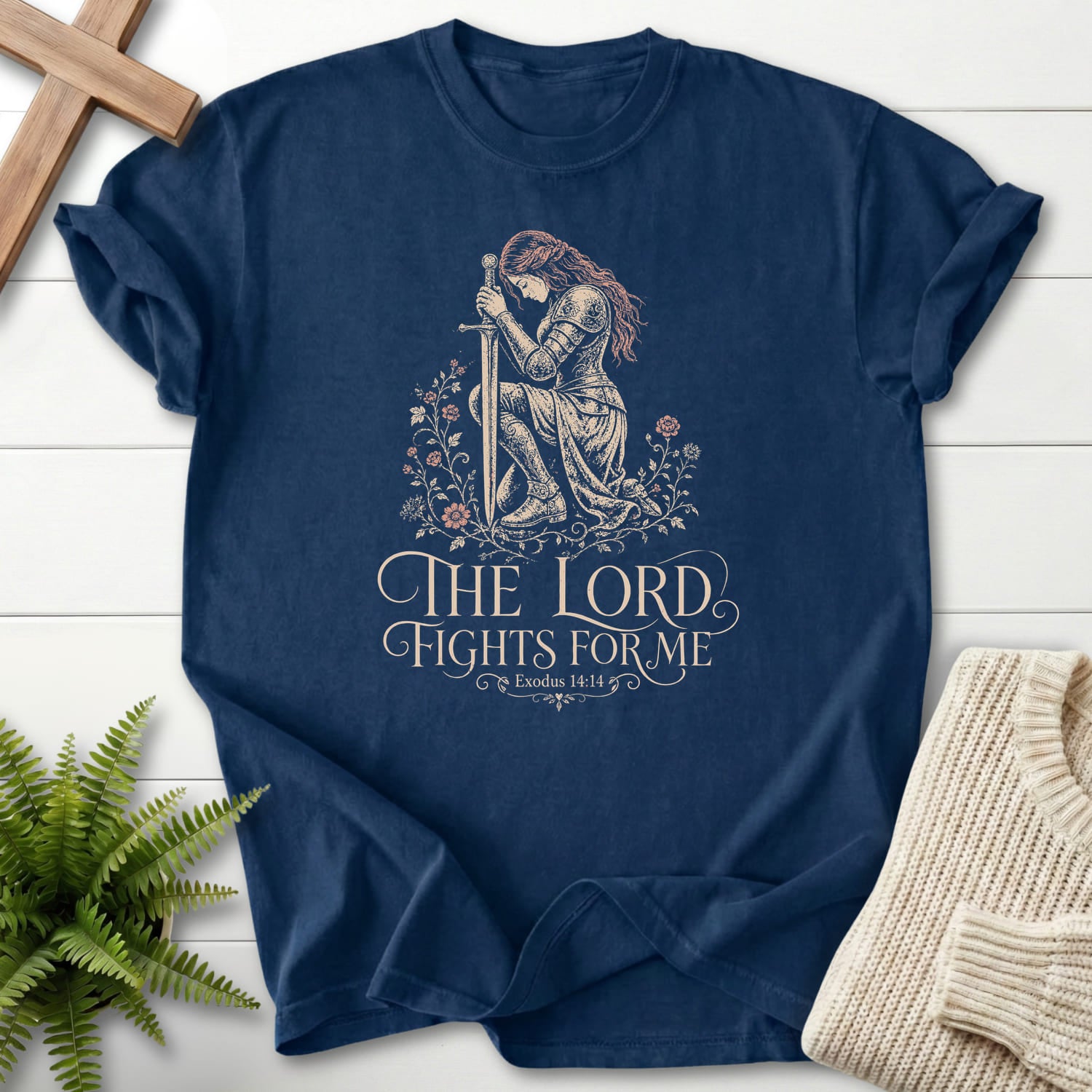 Flatlay of a Navy Christian graphic tee with floral line art with "CH LORD Fights For Me T-Shirt" This Exodus 14:14.