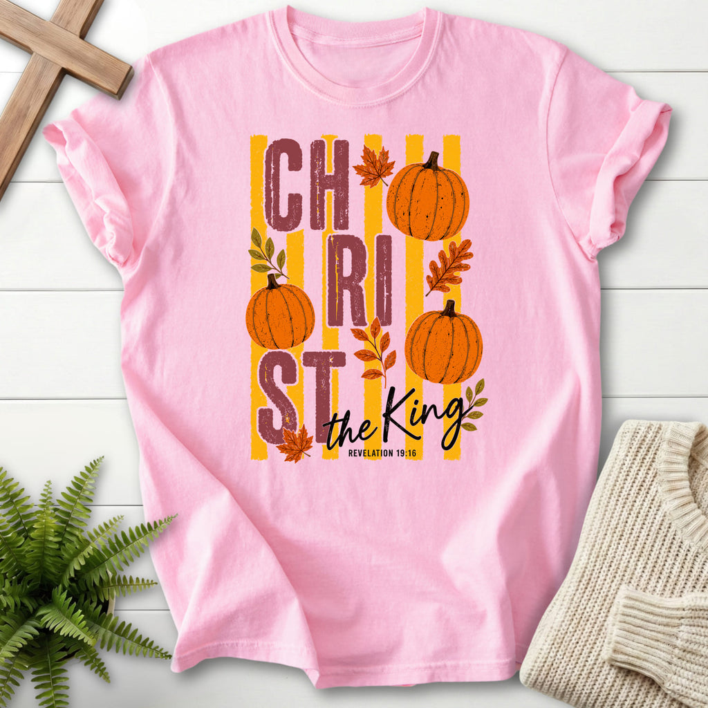 Flatlay of a Blossom Comfort Colors 1717 faith-inspired shirt with script typography with "Christ The King Fall T-Shirt" Revelation 1:16.