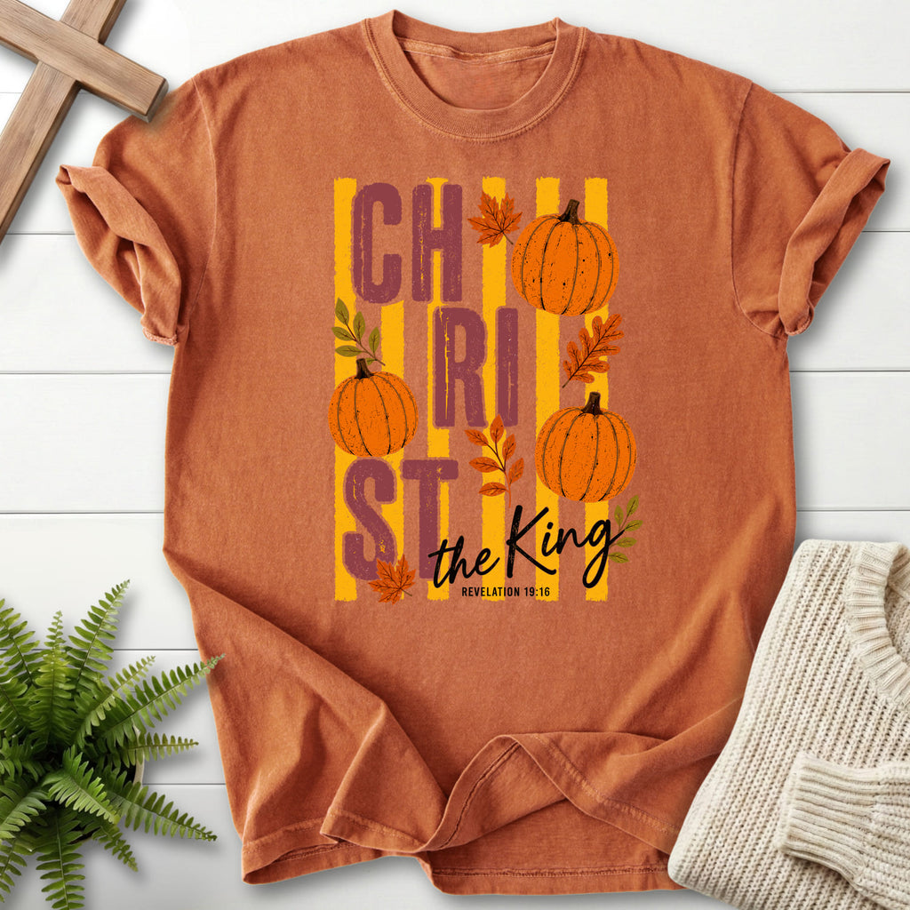 Flat lay of a Yam Bible verse tee featuring script typography with "Christ The King Fall T-Shirt" Revelation 1:16.