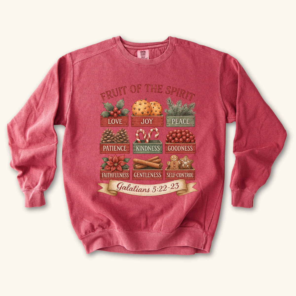 Crimson Christmas Christian sweatshirt with nine vintage crates of holly, oranges, pine, pinecones, candy canes, berries, poinsettia, cinnamon and gingerbread labeled with the fruit of the spirit
