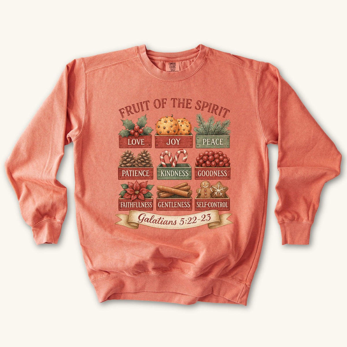 Terracotta Christmas Christian sweatshirt with nine vintage crates of holly, oranges, pine, pinecones, candy canes, berries, poinsettia, cinnamon and gingerbread labeled with the fruit of the spirit