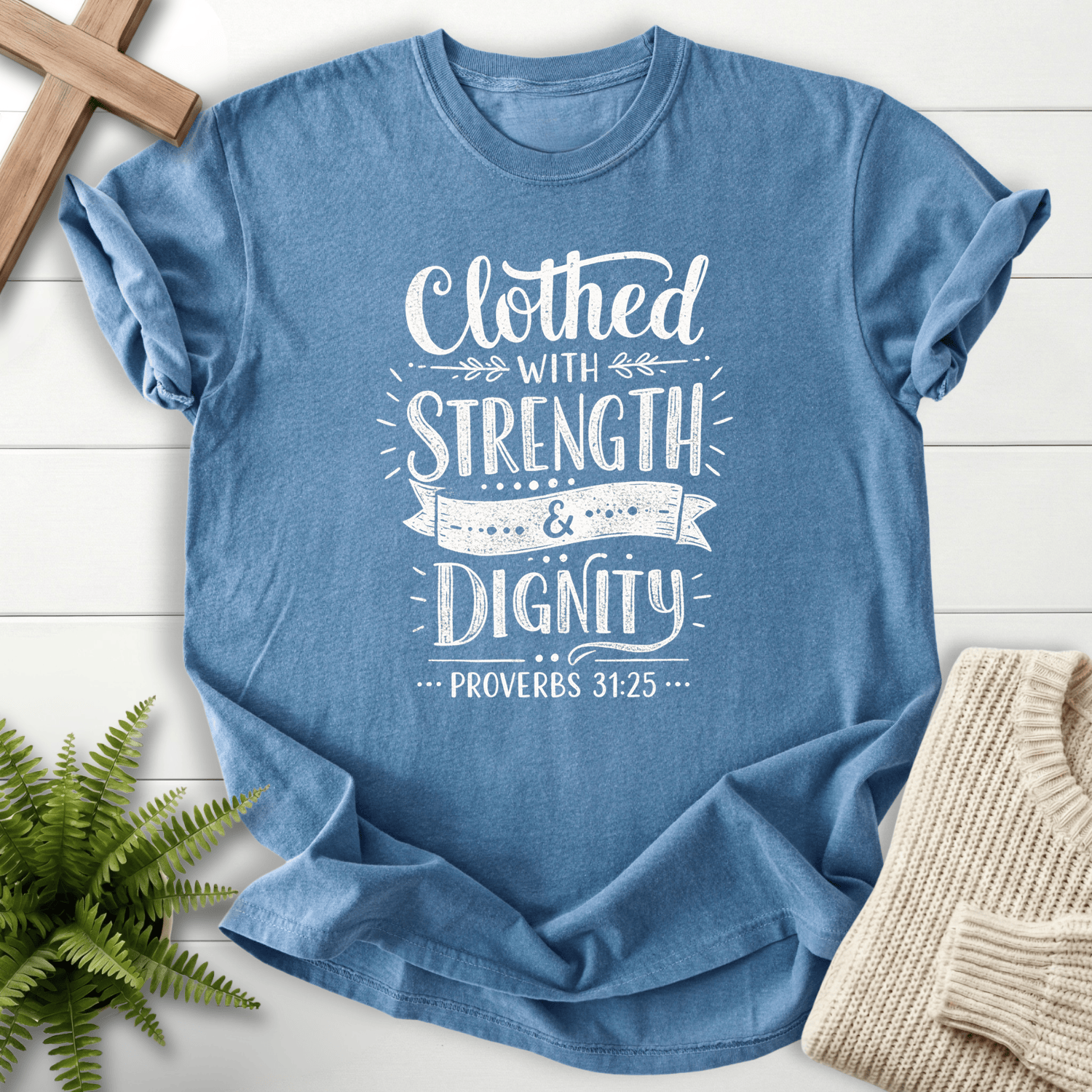 Blue Jean Christian t-shirt for women with mixed typography and ribbon banner accents, inspired by Proverbs 31:25.
