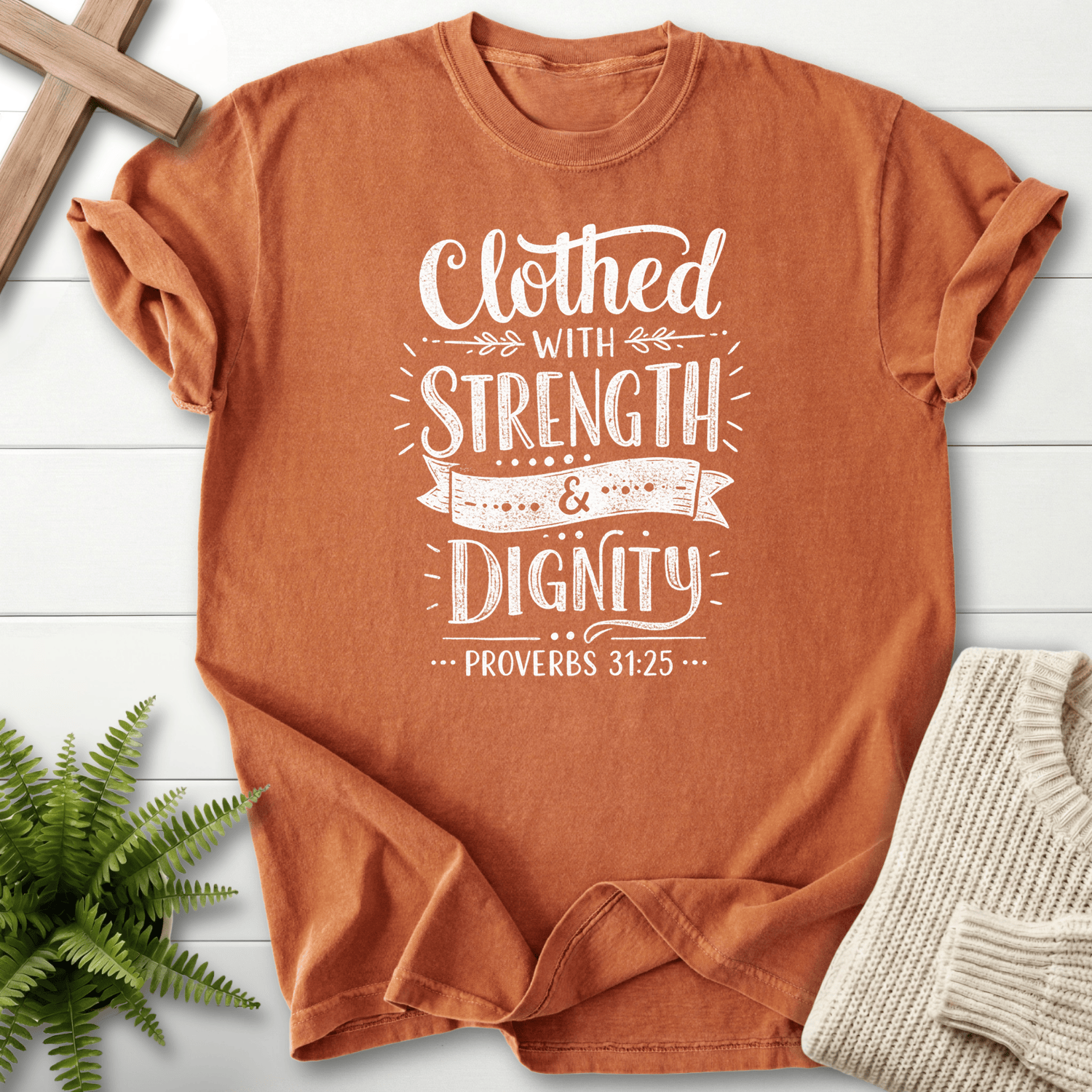 Yam Christian t-shirt for women with a white banner ribbon design and leaf details, She Wears Faith, inspired by Proverbs 31:25.