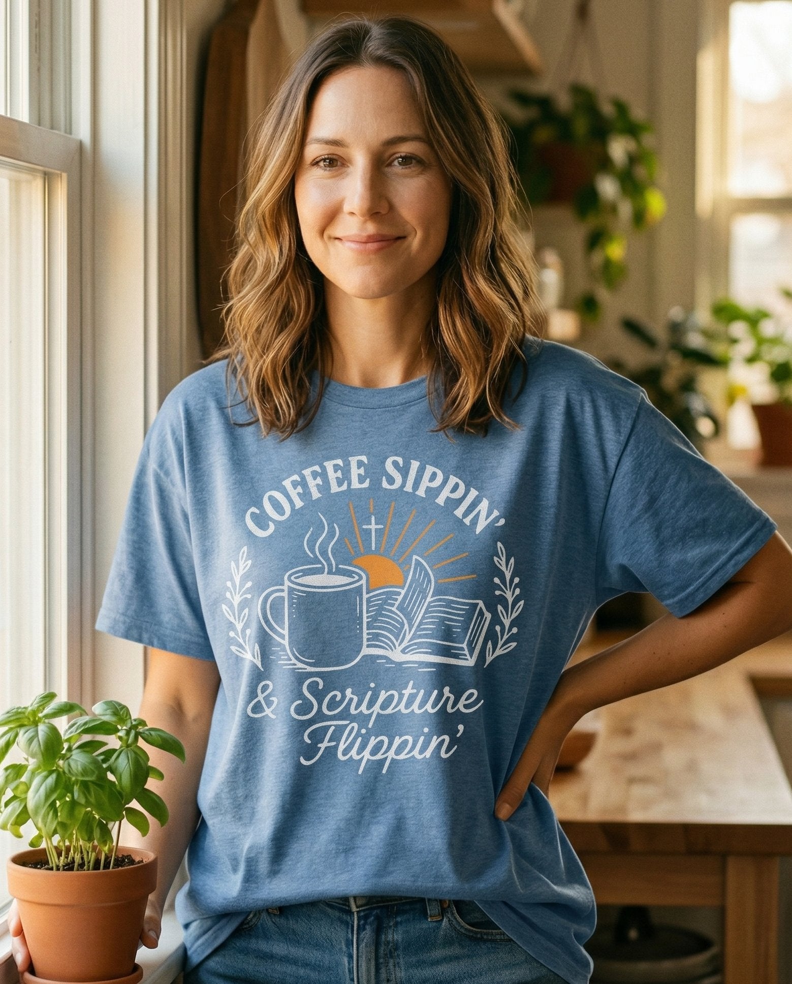 Coffee Sippin' Scripture Flippin' T-shirt – Blue Jean women's Christian tee, lifestyle photo in morning kitchen setting – Retro circular badge design with a coffee mug and open Bible – She Wears Faith
