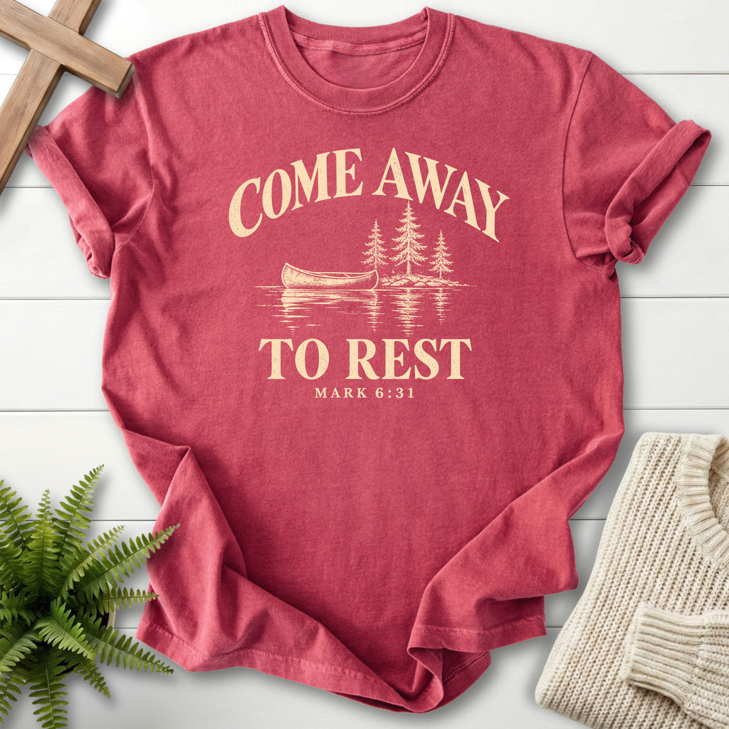 Flatlay of a Crimson Comfort Colors 1717 Bible verse tee with "Come Away to Rest T-Shirt" Mark 6:31.