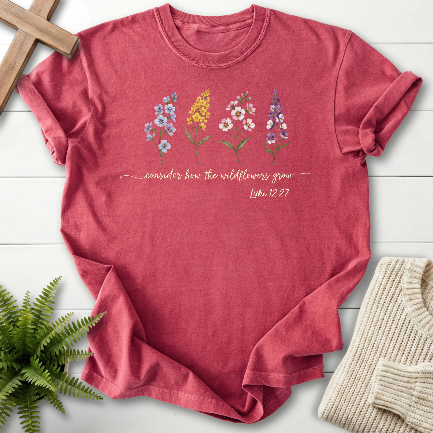 Crimson Christian t-shirt for women with an illustrated wildflower row, Comfort Colors 1717, inspired by Luke 12:27.