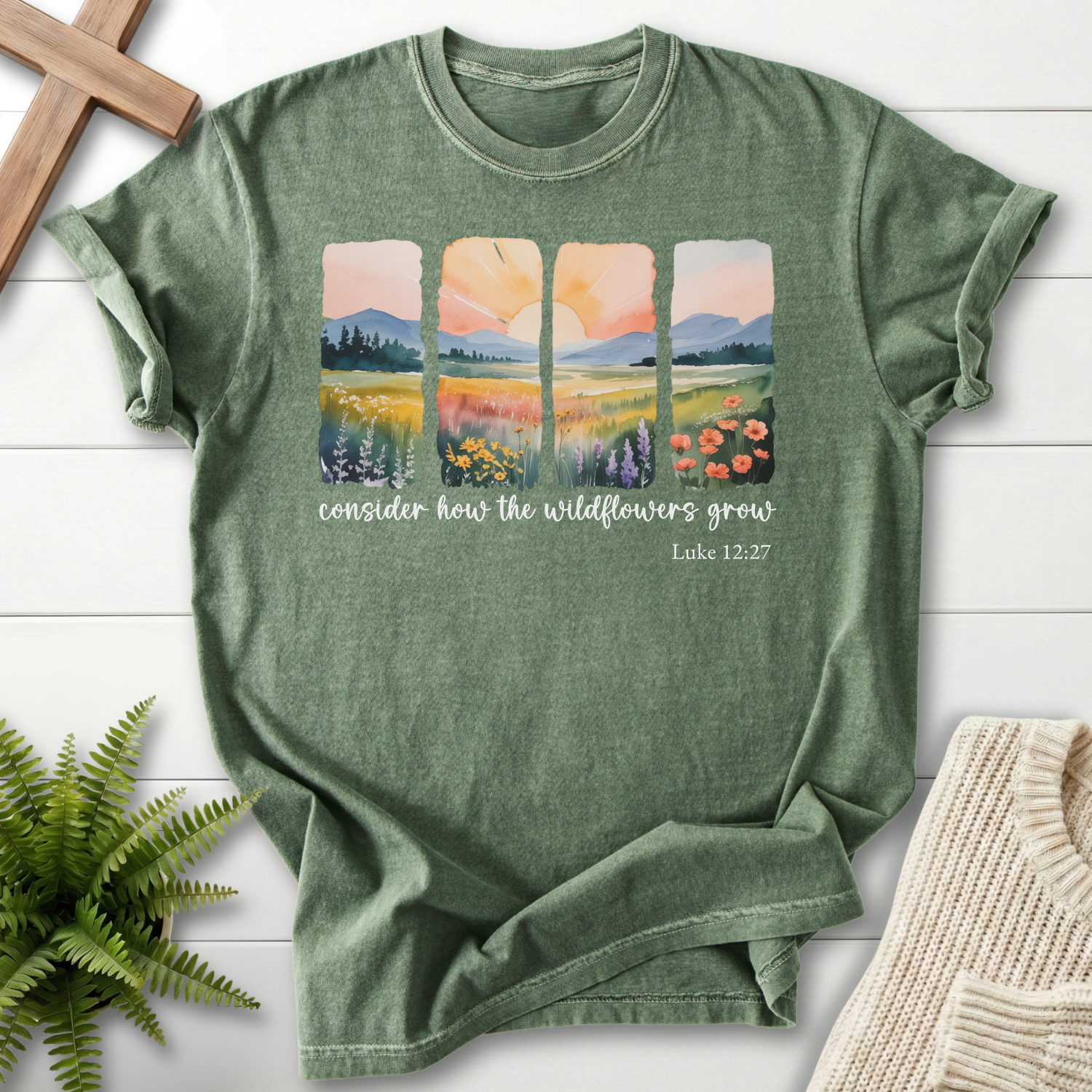 Moss Christian t-shirt for women with a watercolor wildflower meadow panel design, inspired by Luke 12:27.