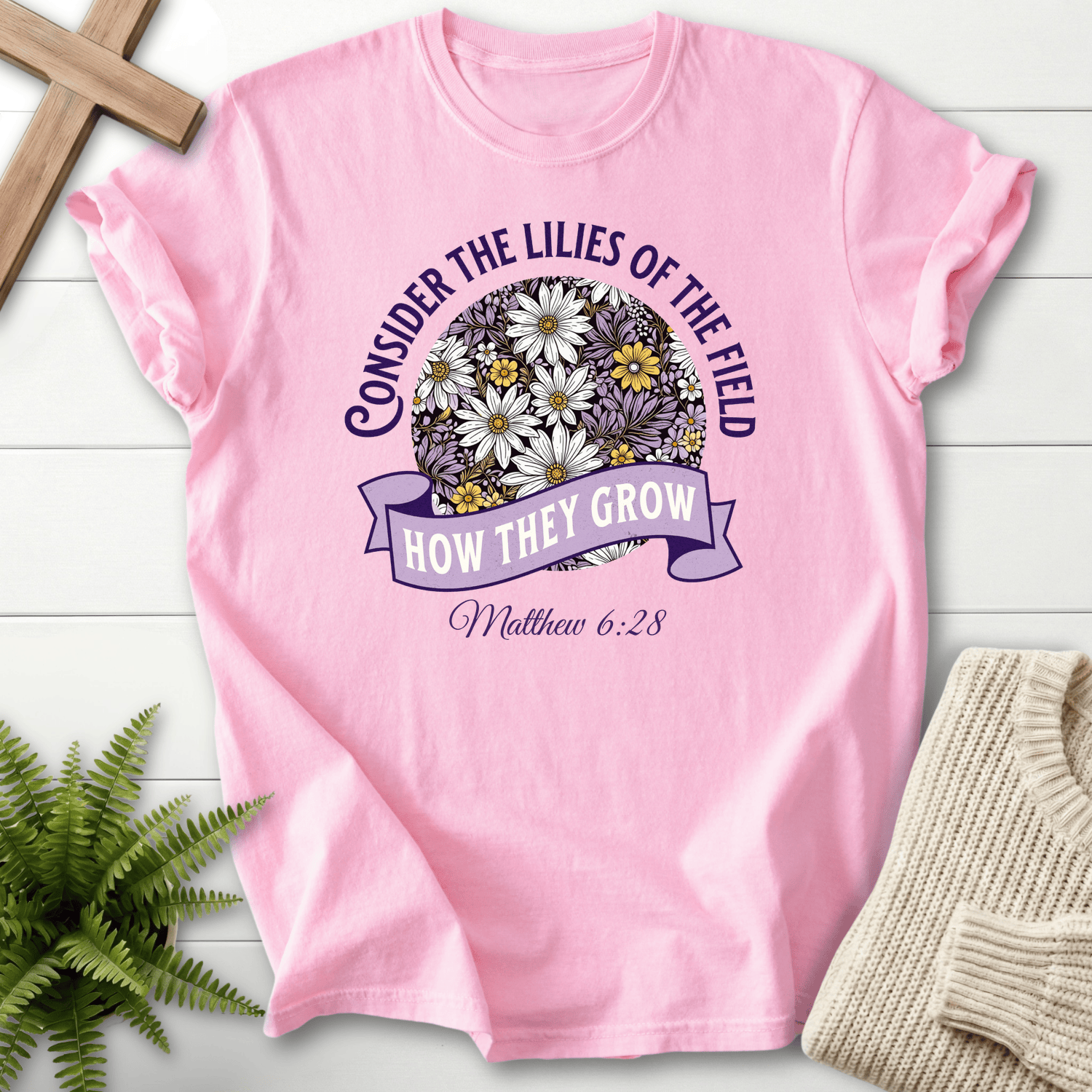Blossom Christian t-shirt for women with a floral circle graphic, inspired by Matthew 6:28.