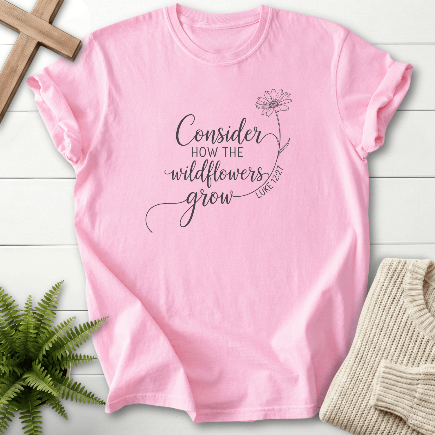 Blossom Christian t-shirt for women with delicate black line art design, inspired by Luke 12:27.