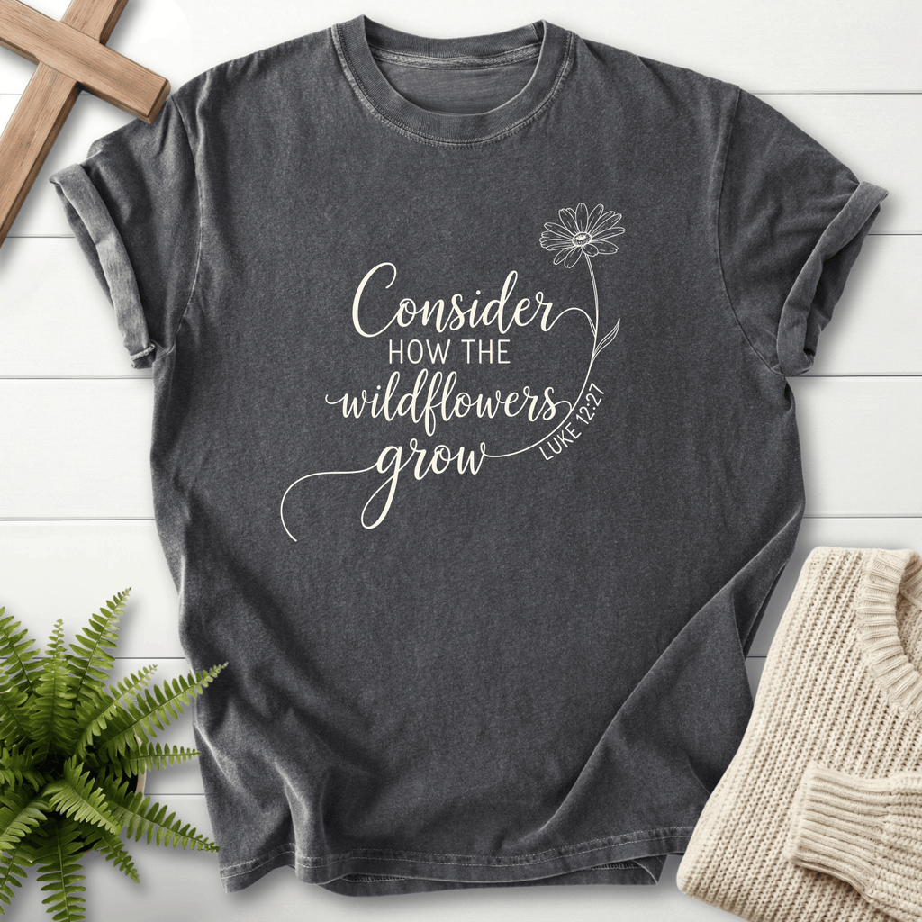 Pepper Christian t-shirt for women with white cursive lettering and daisy line art, inspired by Luke 12:27.