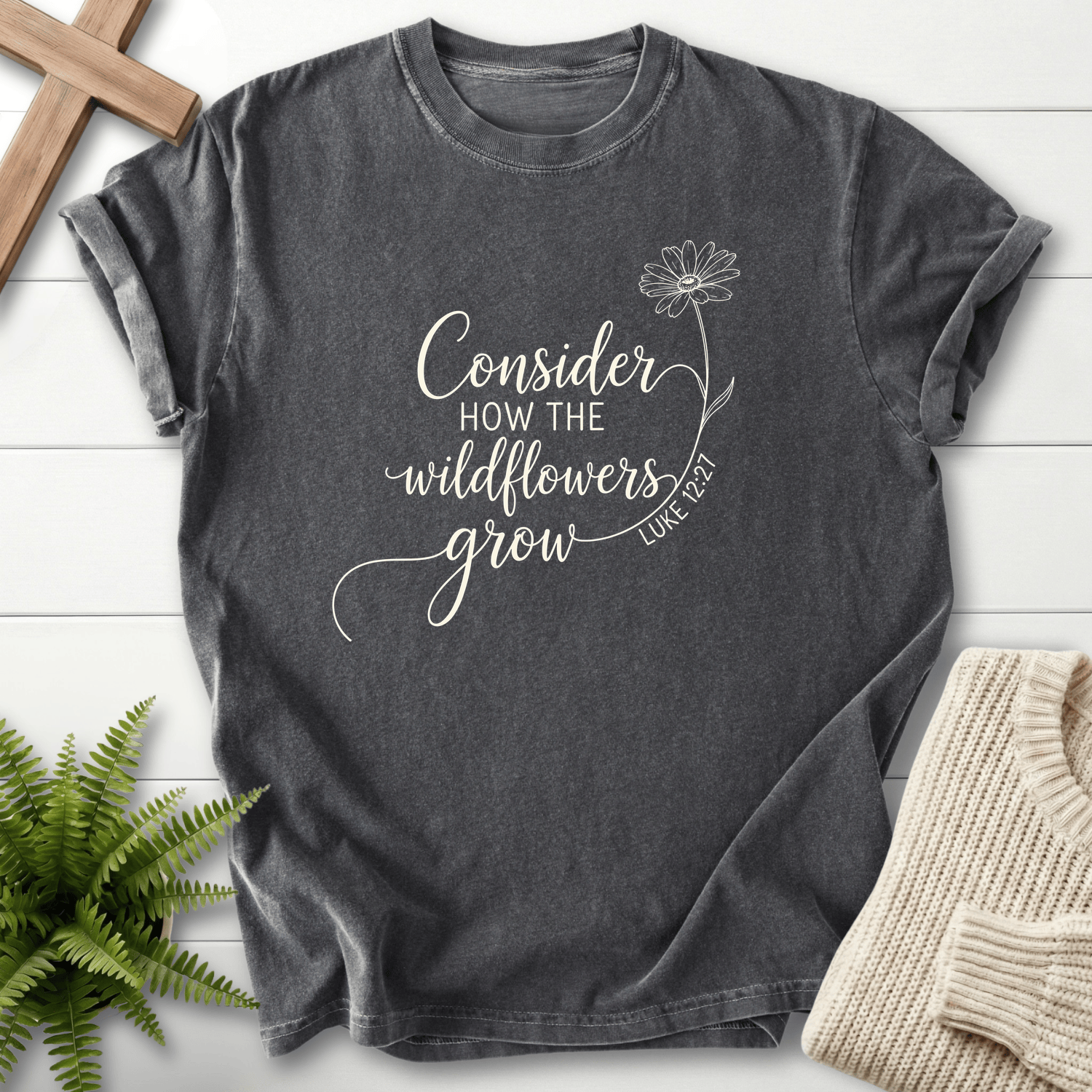 Pepper Christian t-shirt for women with white cursive lettering and daisy line art, inspired by Luke 12:27.