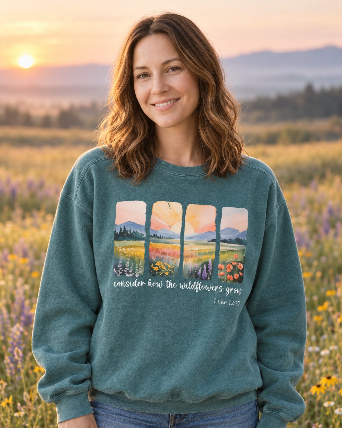 Consider the Wildflowers – Blue Spruce women's Christian sweatshirt, lifestyle photo in wildflower meadow at sunrise – Four watercolor meadow panels above Consider how the wildflowers grow – She Wears Faith