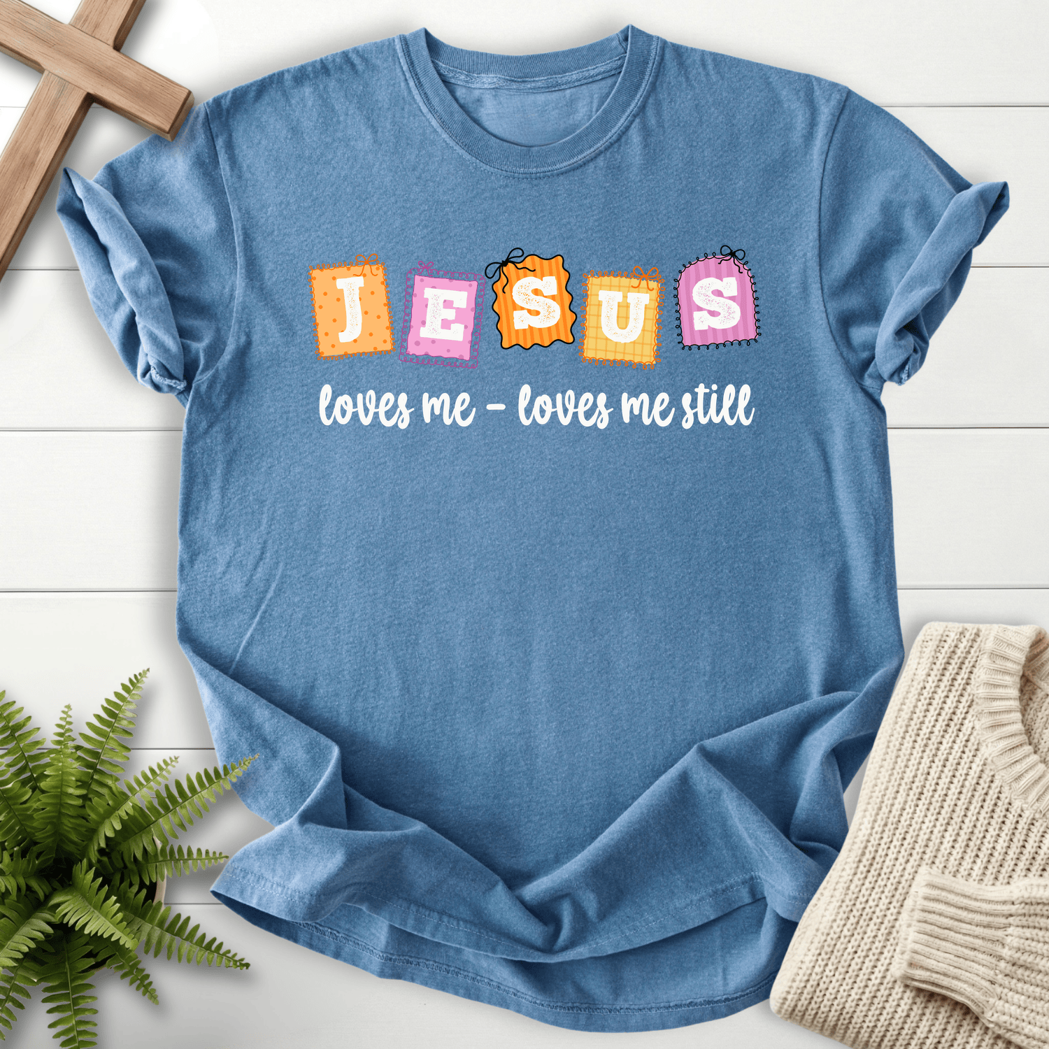 Blue Jean women's Christian t-shirt with colorful patchwork "Jesus loves me loves me still" stamp design