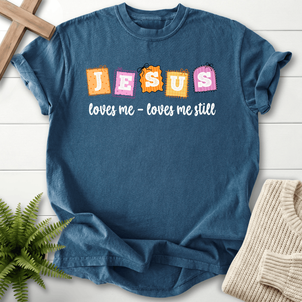 Midnight women's Christian t-shirt with bright "JESUS loves me loves me still" patchwork stamp lettering