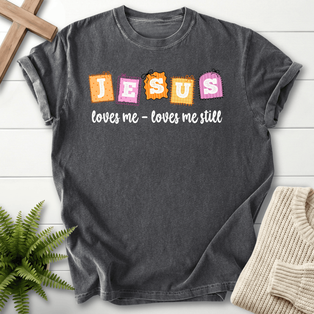 Pepper women's Christian t-shirt with a fun "Jesus loves me still" patchwork graphic