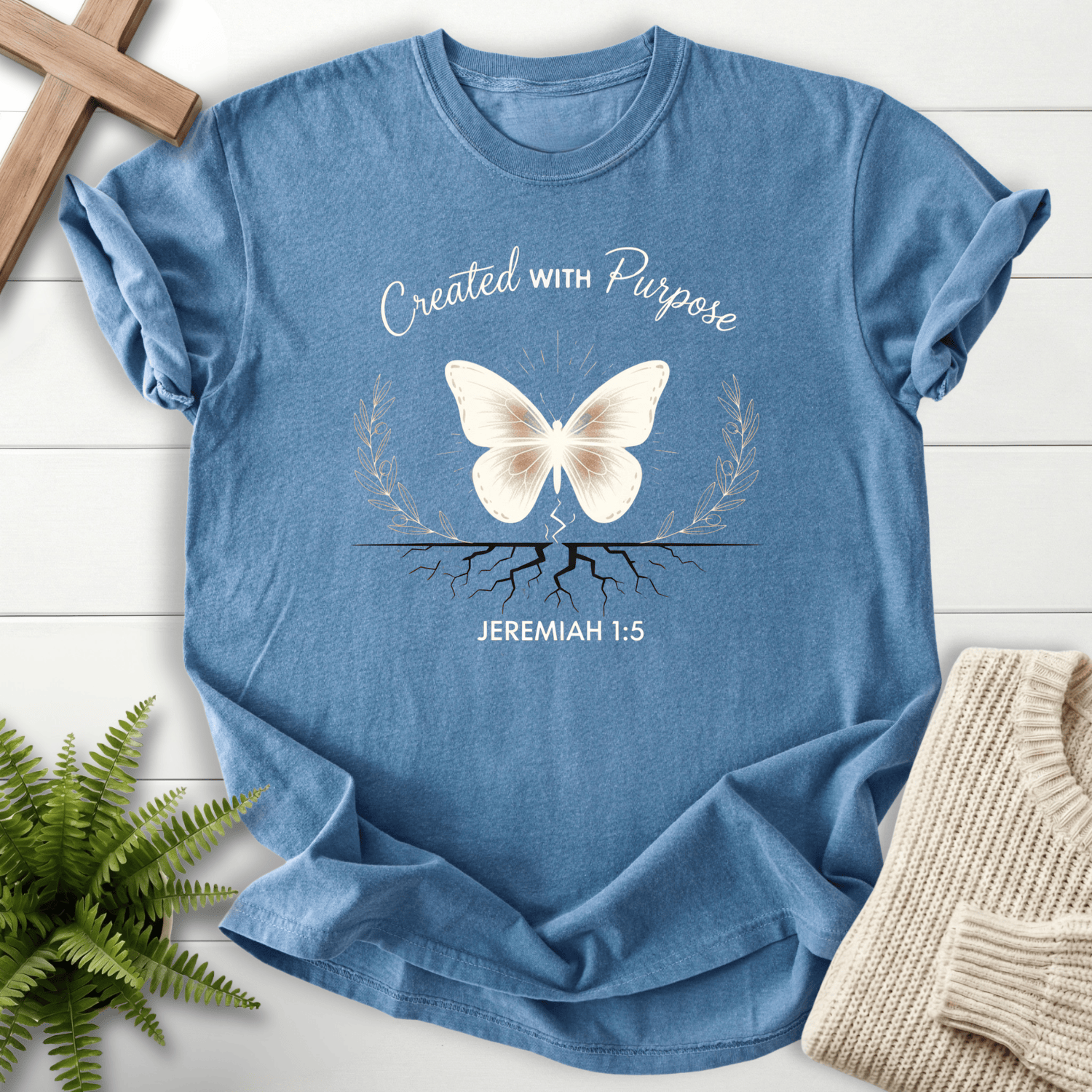 Blue Jean Christian t-shirt for women with a butterfly above roots and olive branch design, inspired by Jeremiah 1:5.