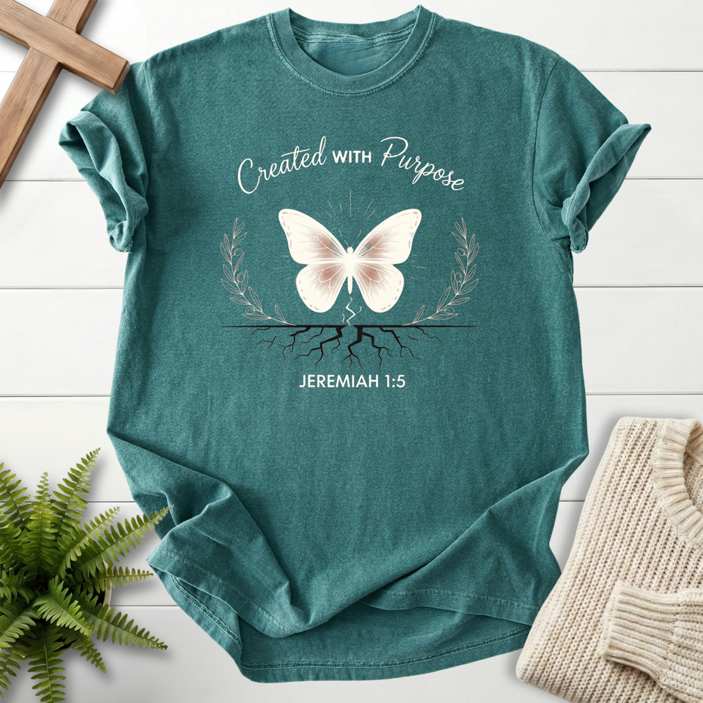 Blue Spruce Christian t-shirt for women with a white butterfly and glowing roots illustration, inspired by Jeremiah 1:5.