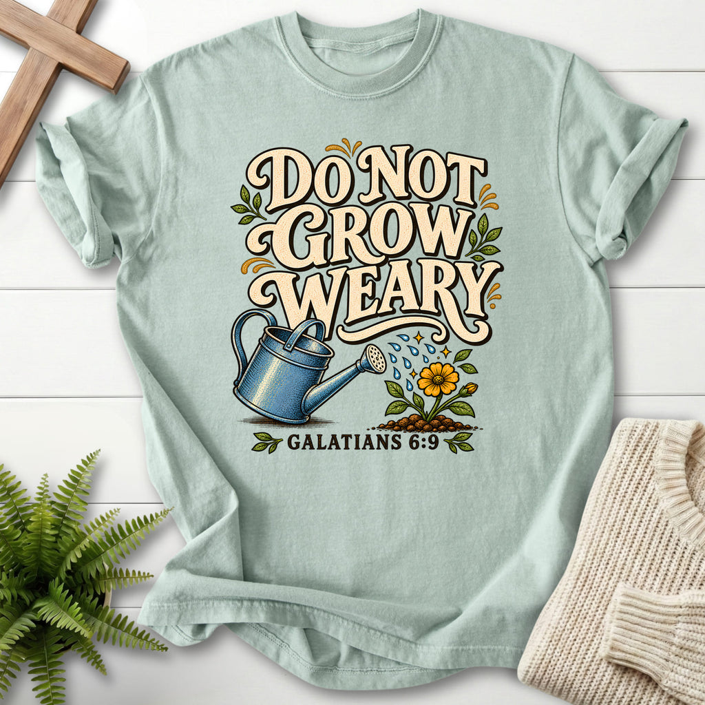 Flat lay of a Bay faith-inspired shirt featuring flower artwork with "Do Not Grow Weary Galatians 6 9 T-Shirt" Galatians 6:9.