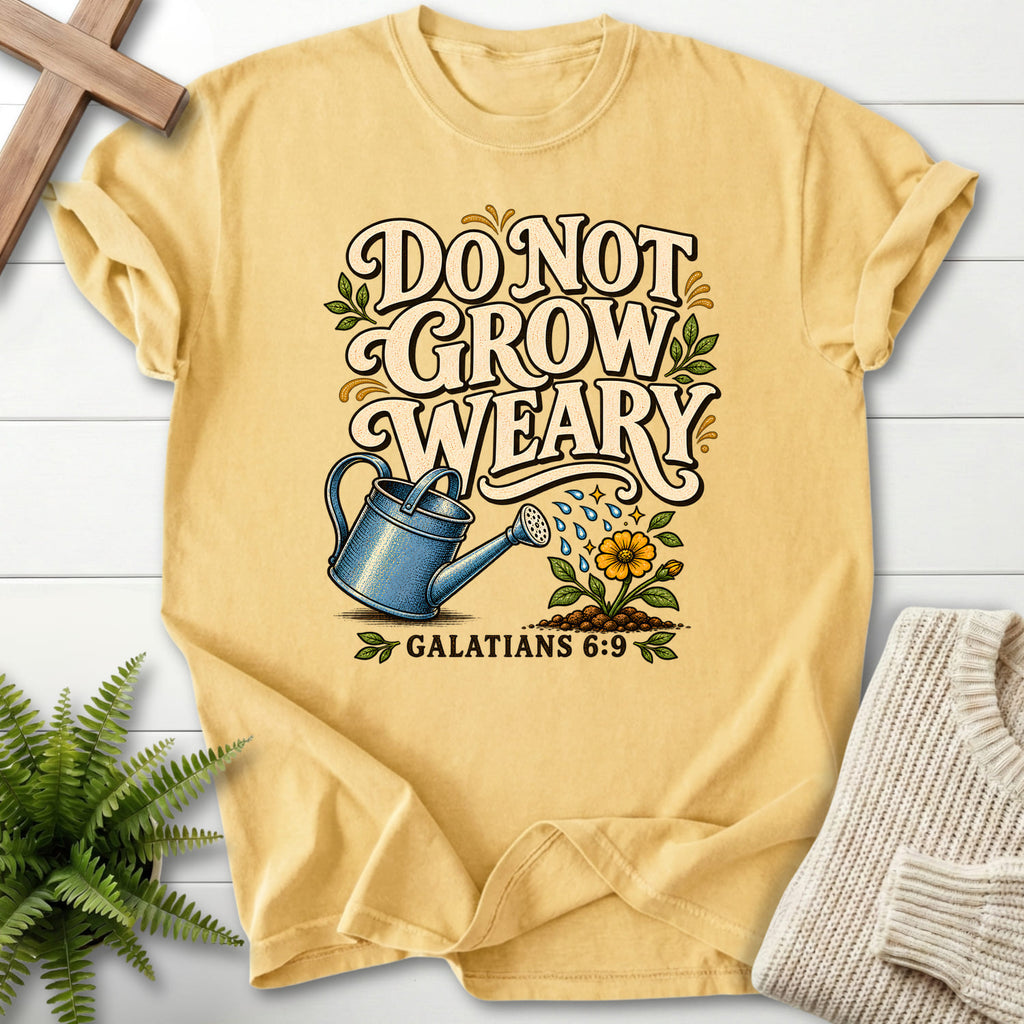 Flatlay of a Butter Christian shirt with flower artwork with "Do Not Grow Weary Galatians 6 9 T-Shirt" Galatians 6:9.