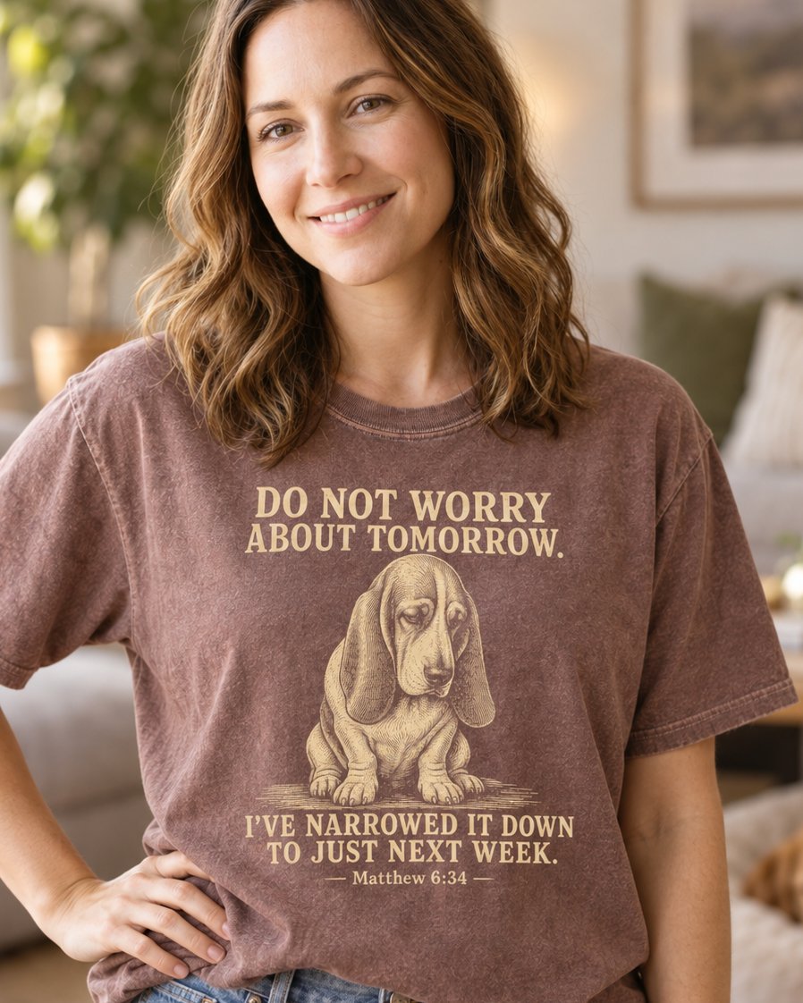 Do Not Worry About Tomorrow, Espresso women's Christian tee, lifestyle photo in cozy living room, Engraved sad basset hound with funny next week text, Matthew 6:34, She Wears Faith