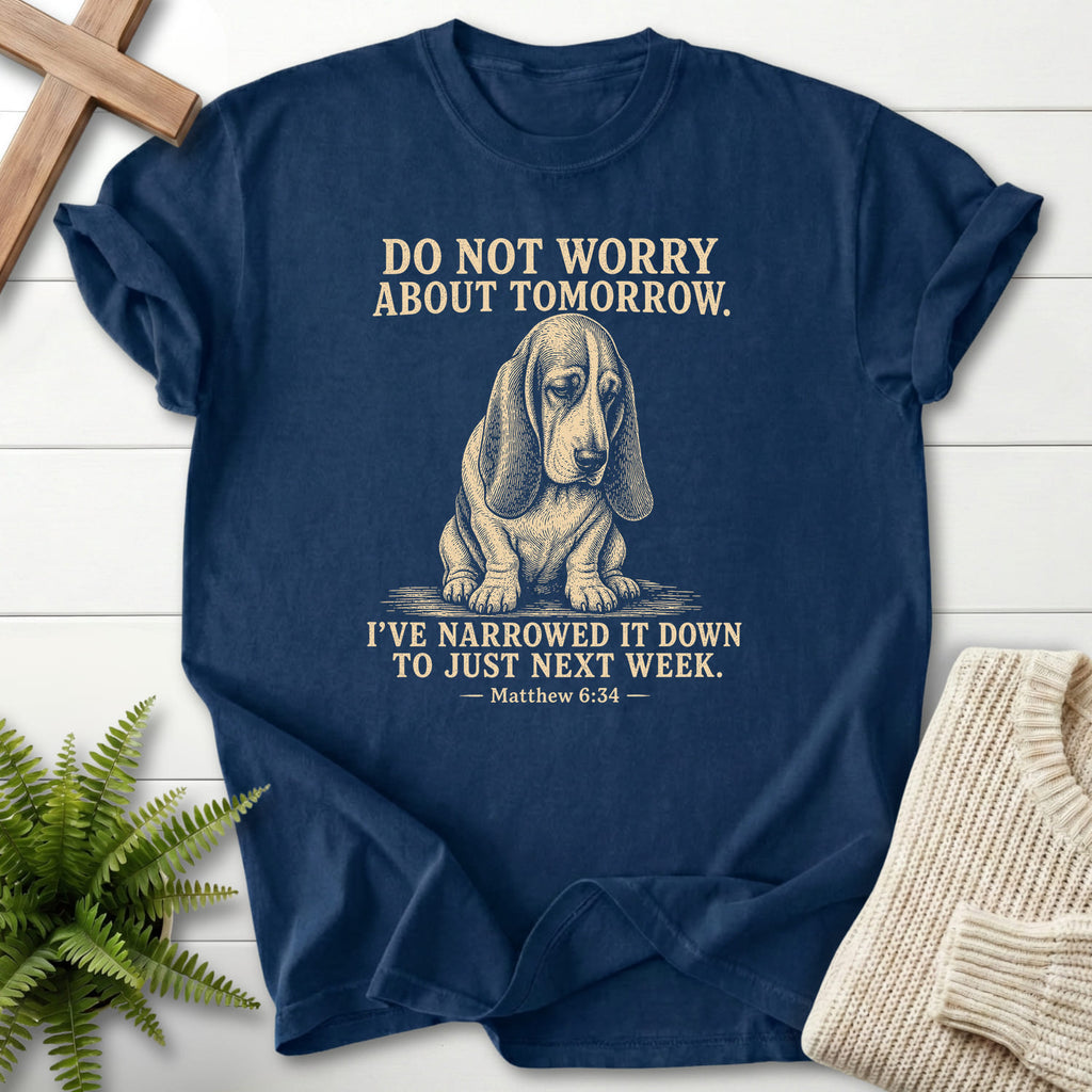 Flatlay of a Navy Bible verse tee with "Do Not Worry About Tomorrow T-Shirt" Matthew 6:34.