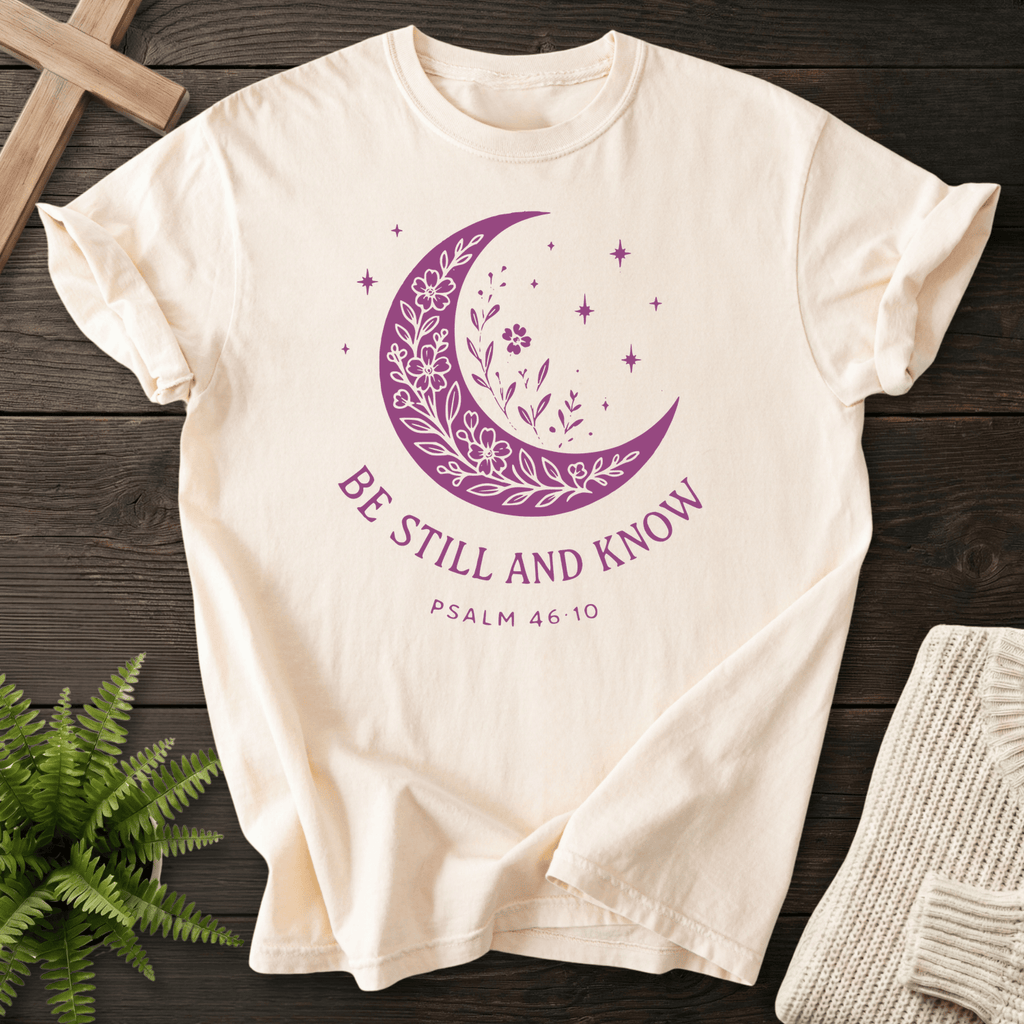 Ivory women's faith t-shirt with a floral crescent moon, stars, and 'Be Still and Know', Psalm 46:10.