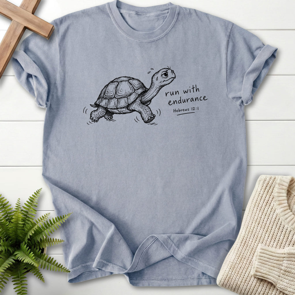 Flat lay of a Granite Christian graphic tee featuring "Endurance Turtle Hebrews 12:1 T-Shirt" Hebrews 12:1.