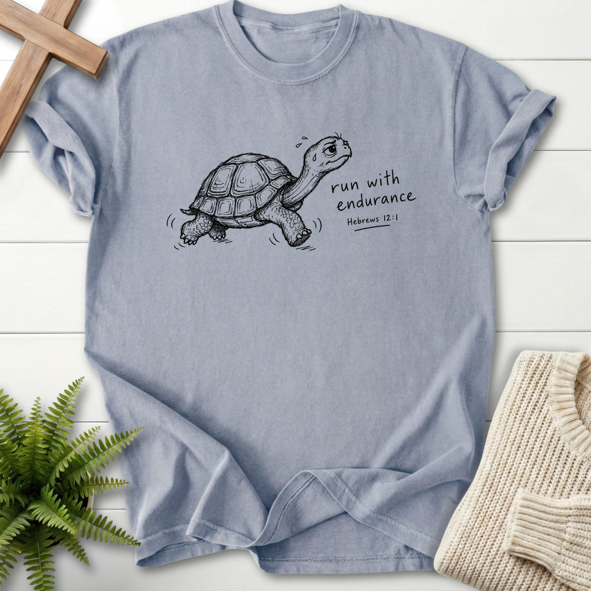 Flat lay of a Granite Christian graphic tee featuring "Endurance Turtle Hebrews 12:1 T-Shirt" Hebrews 12:1.