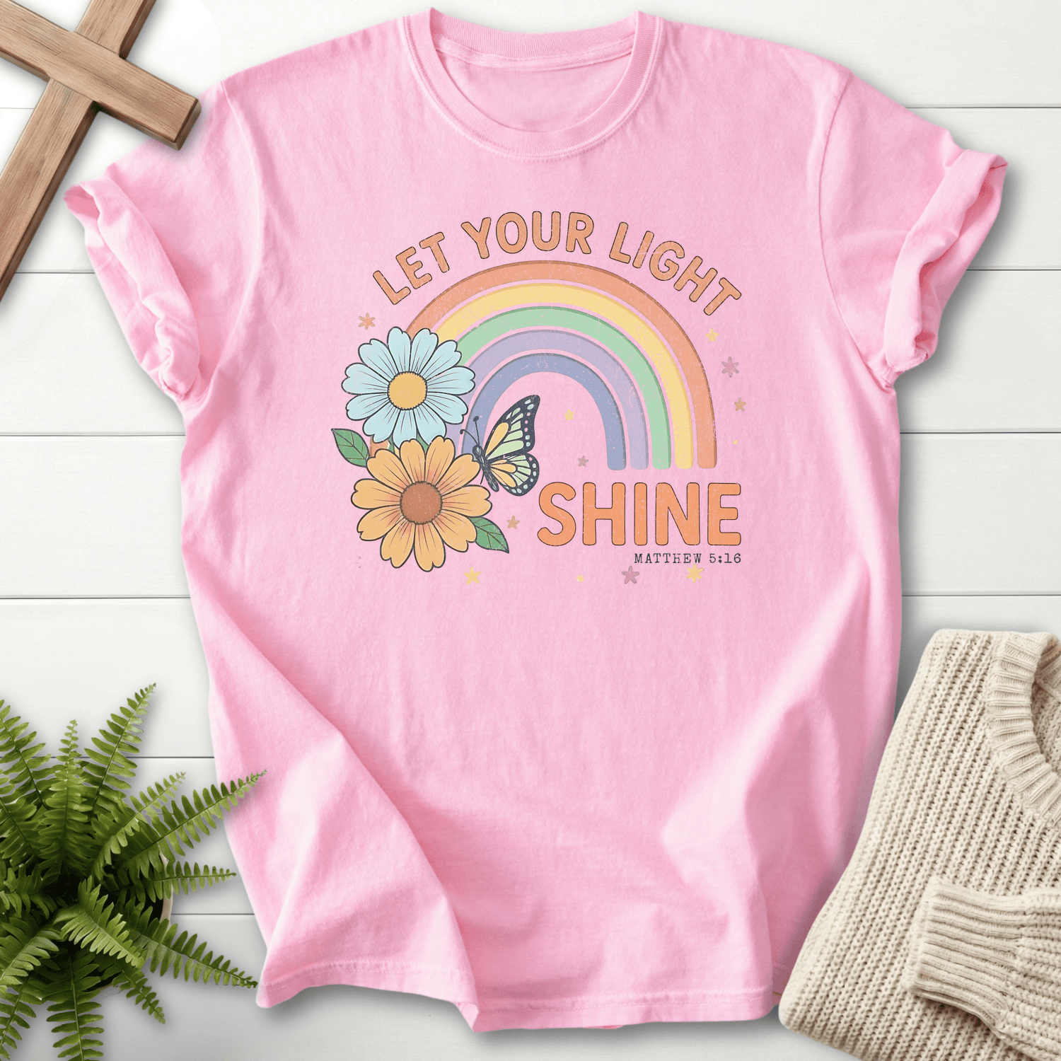 Blossom women's Christian t-shirt with retro floral rainbow and "Let Your Light Shine" lettering, inspired by Matthew 5:16.