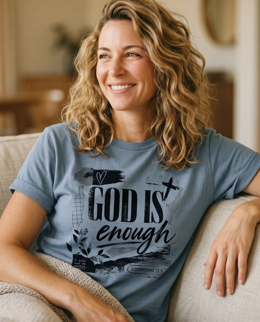 God Is Enough – Granite women's Christian tee, lifestyle photo in cozy living room – God Is Enough faith script lettering – She Wears Faith