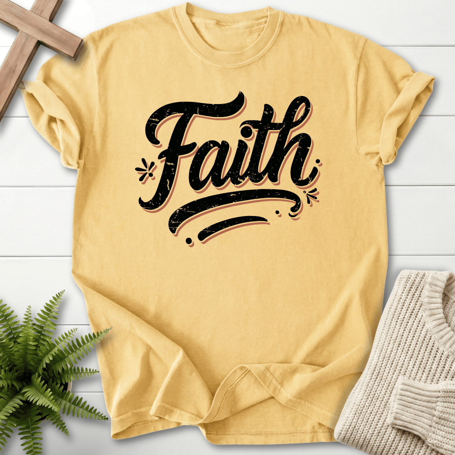 Butter yellow Christian t-shirt for women with bold distressed typography and floral detail.