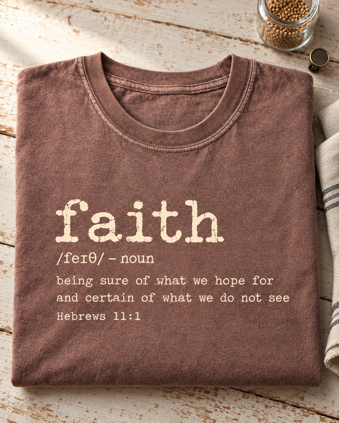 Faith Definition Hebrews 11:1, Espresso women's Christian tee, lifestyle photo in folded flat lay, faith definition lettering in typewriter type, She Wears Faith