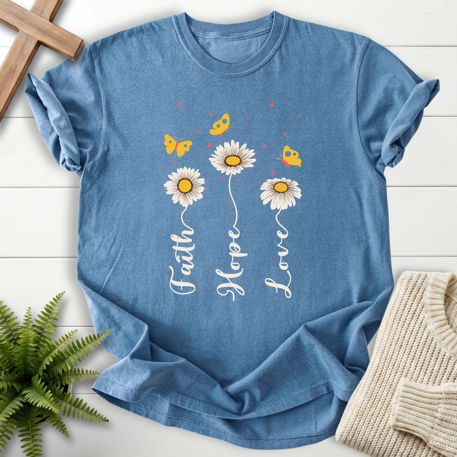 Blue Jean Christian t-shirt for women with three daisy stems and cursive script, with yellow butterflies.
