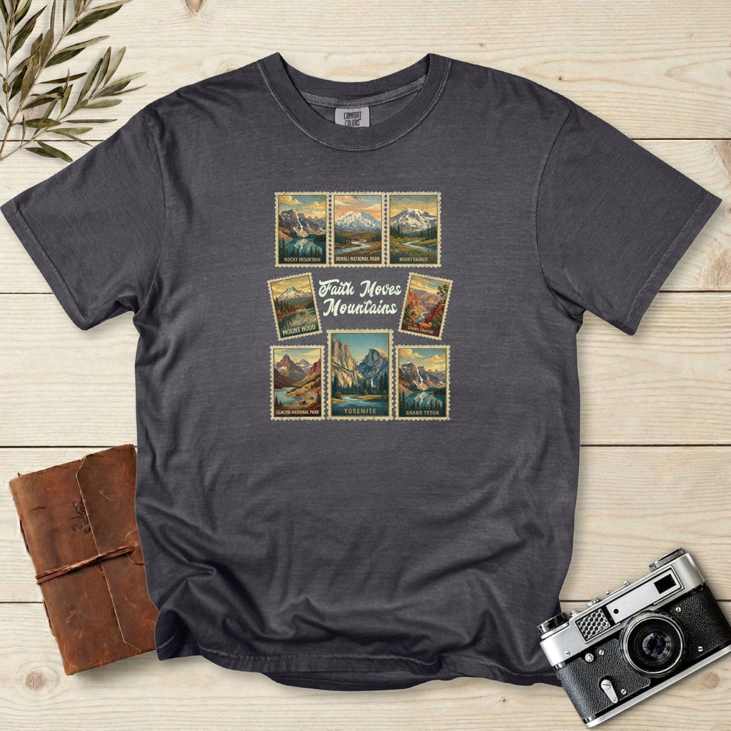 Comfort Colors 1717 pepper Christian women tee featuring a vintage travel-stamp design with US national parks and the phrase ‘Faith Moves Mountains.’ Soft outdoor-inspired Christian tshirt perfect for faith wear and adventure lover