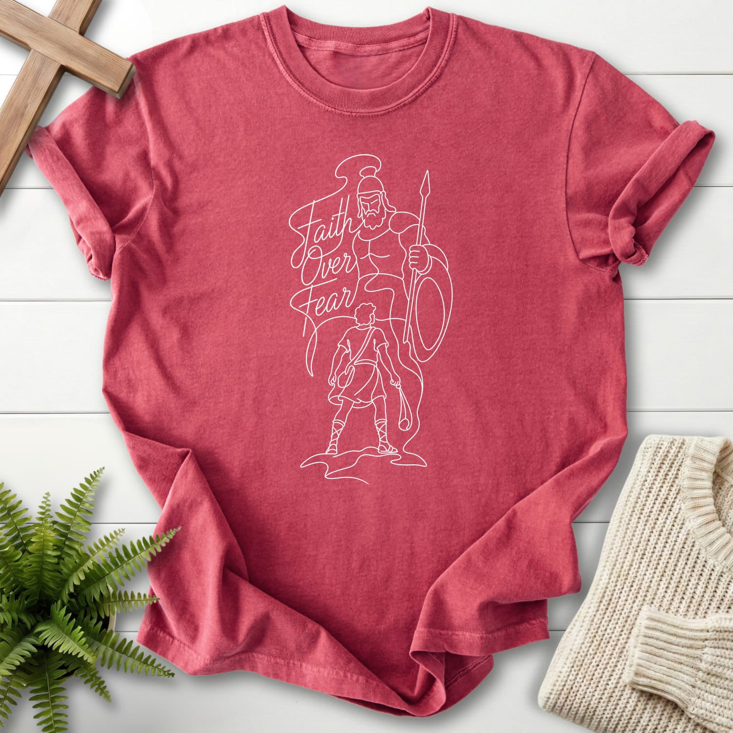 Crimson color option for the Faith Over Fear David vs Goliath tee with script typography with "Faith Over Fear David vs Goliath T-Shirt" for women's.