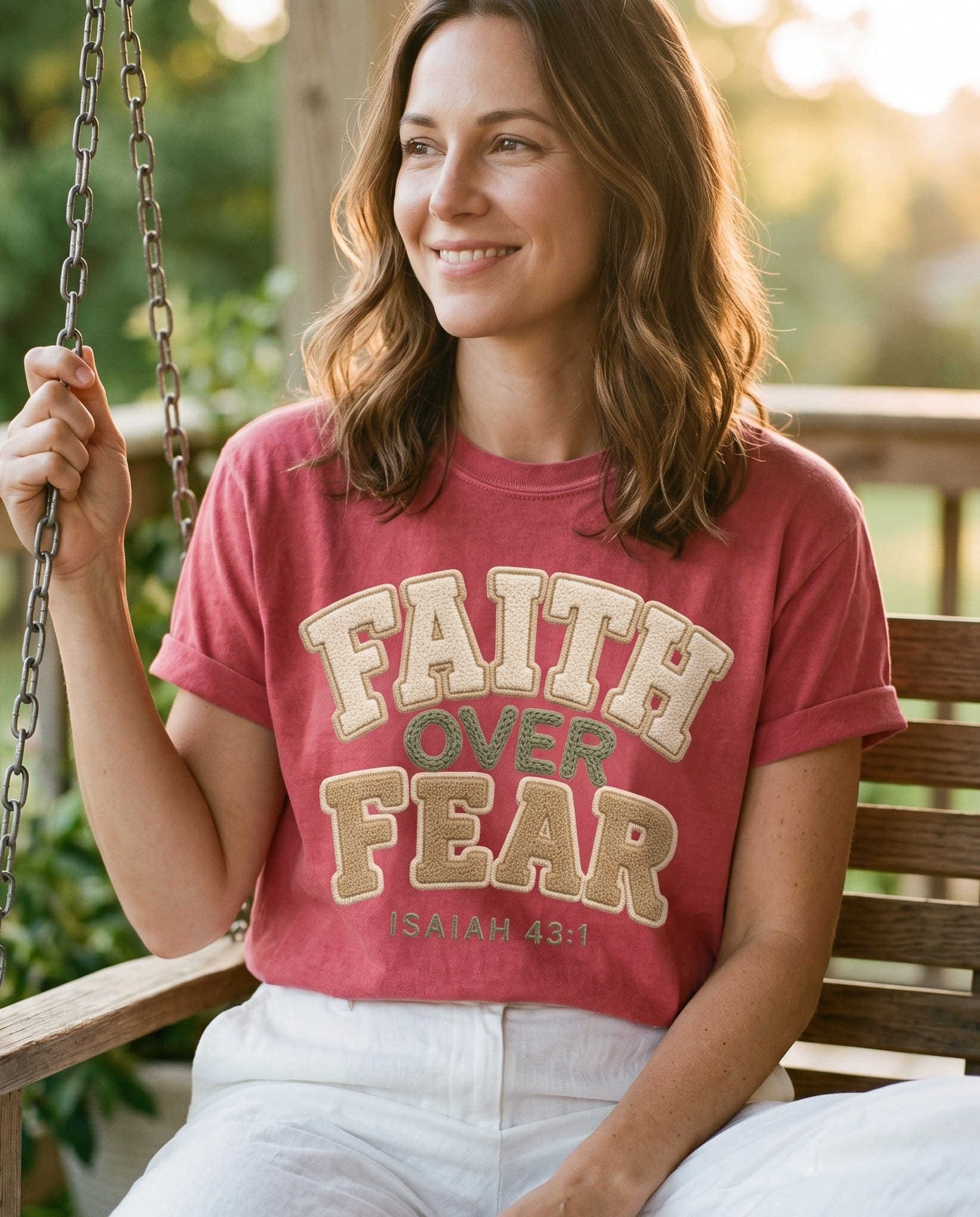 Faith Over Fear Faux Fur Isaiah 43:1 – Crimson women's Christian tee, lifestyle photo in sunny porch – Chenille faux-fur patch-style lettering FAITH in cream – Isaiah 43:1 – She Wears Faith