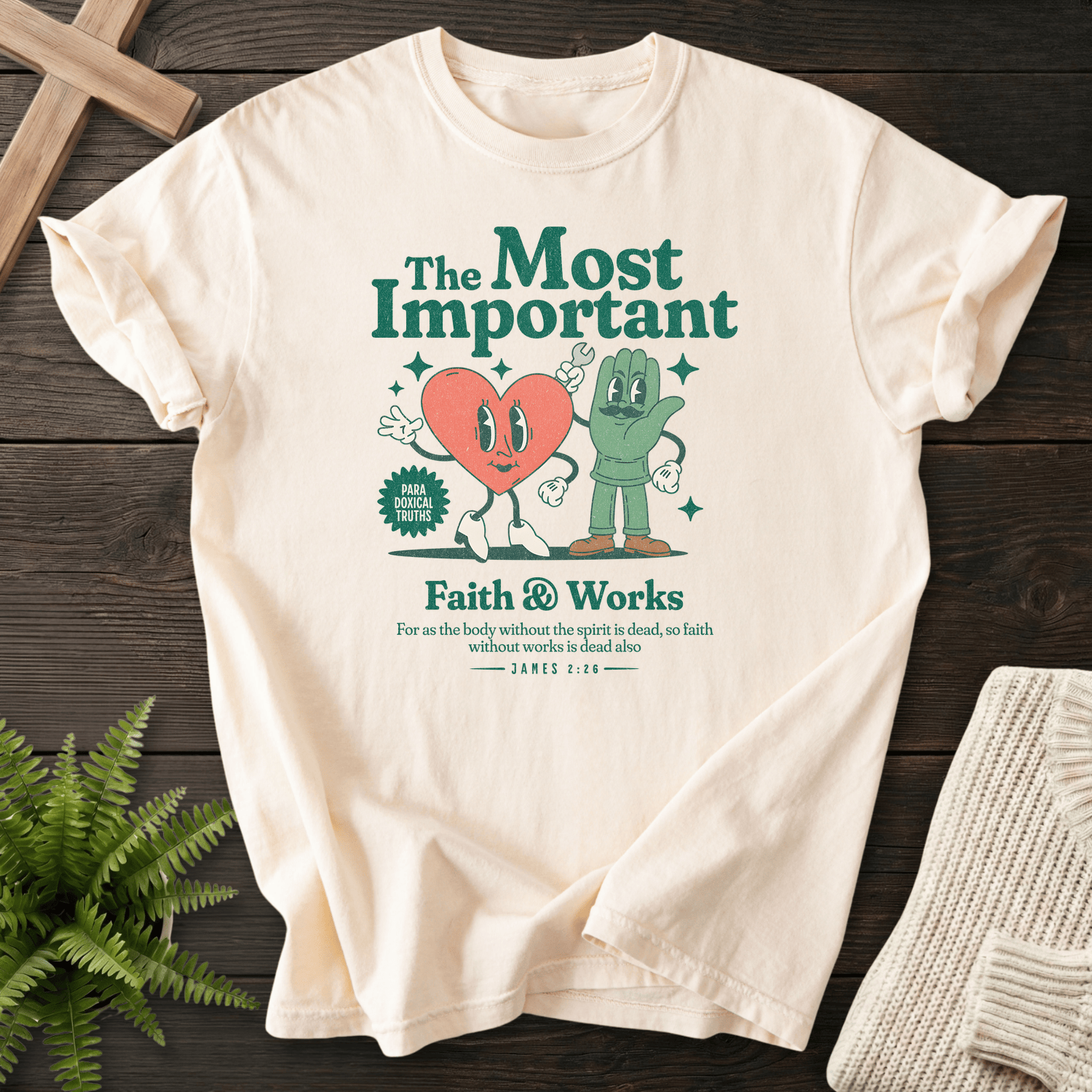 Ivory women's faith t-shirt with a groovy retro cartoon illustration and the phrase 'Faith and Works', inspired by James 2:26.