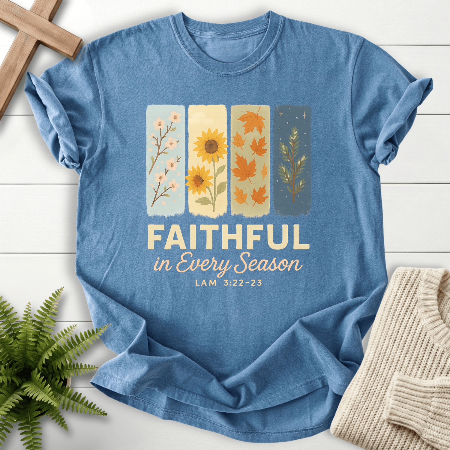 Blue Jean women's faith t-shirt with four seasonal illustration panels, inspired by Lamentations 3:22-23.