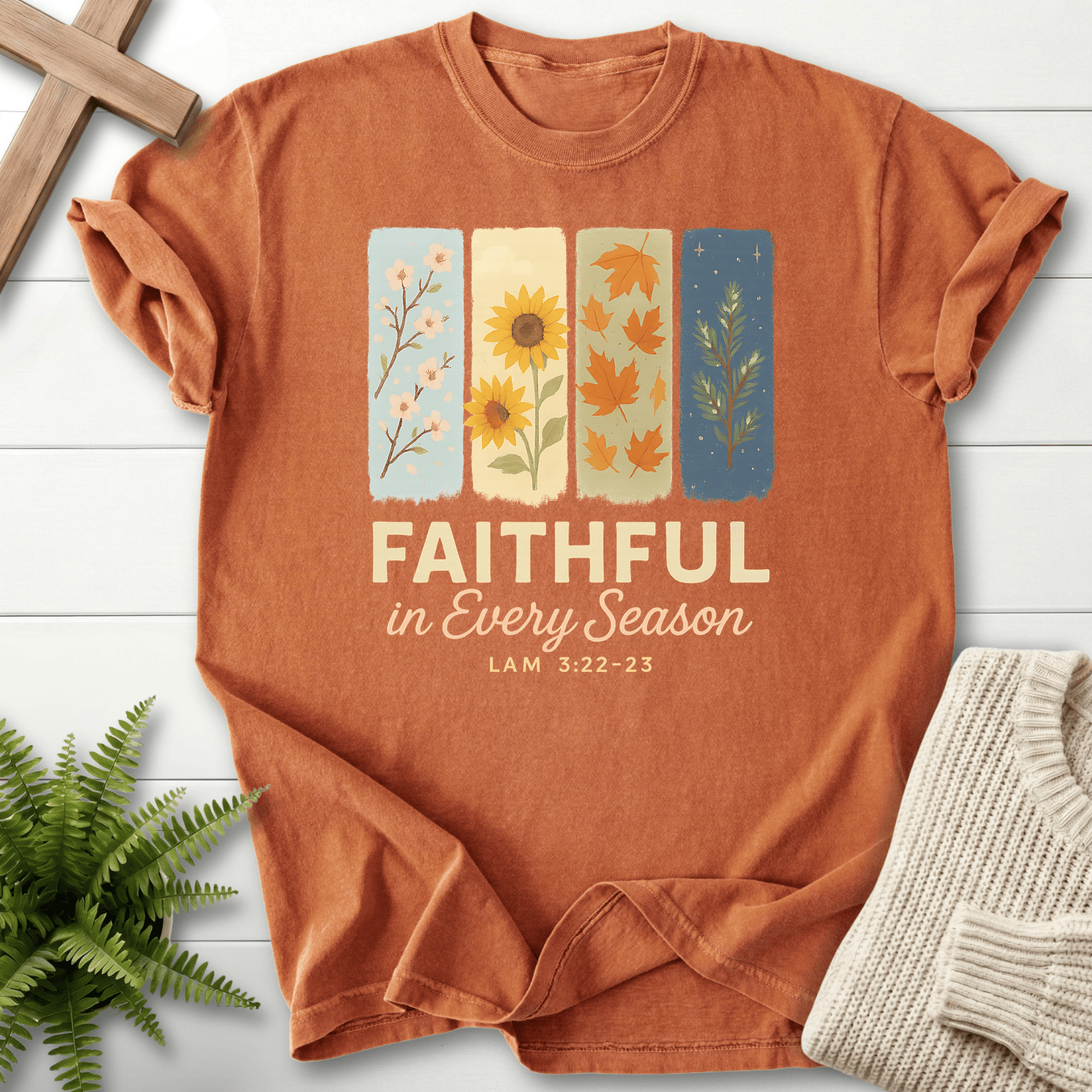 Yam women's faith t-shirt with a four-panel design featuring spring, sunflower, and autumn leaves, inspired by Lamentations 3:22-23.