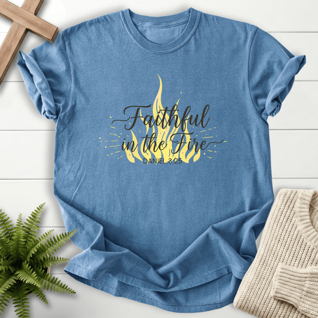 Blue Jean women's faith t-shirt with a yellow flame illustration and script lettering, inspired by Daniel 3:25.