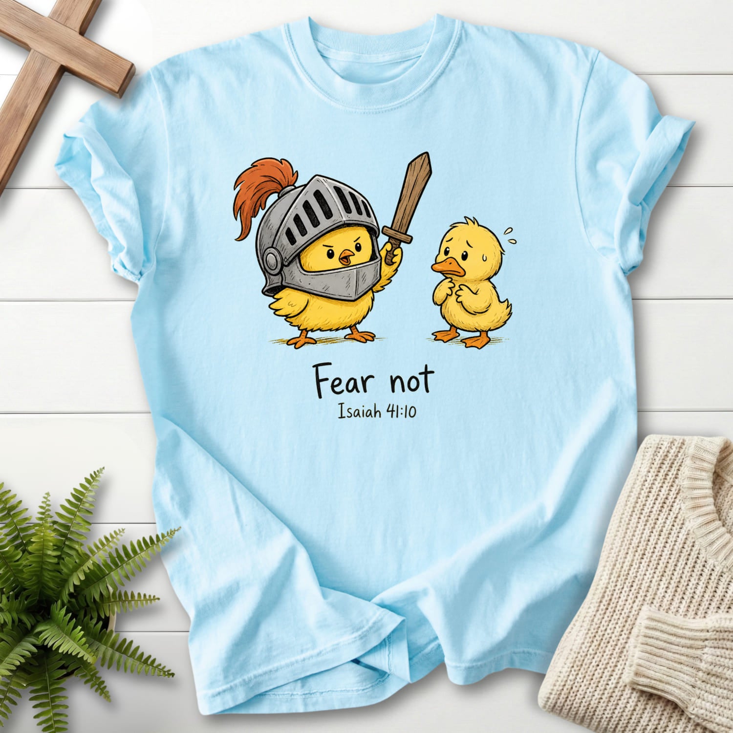 Flat lay of a Chambray Comfort Colors 1717 Christian t-shirt for women featuring "Fear Not Isaiah 41:10 Chick T-Shirt" Isaiah 41:10 From Printify.