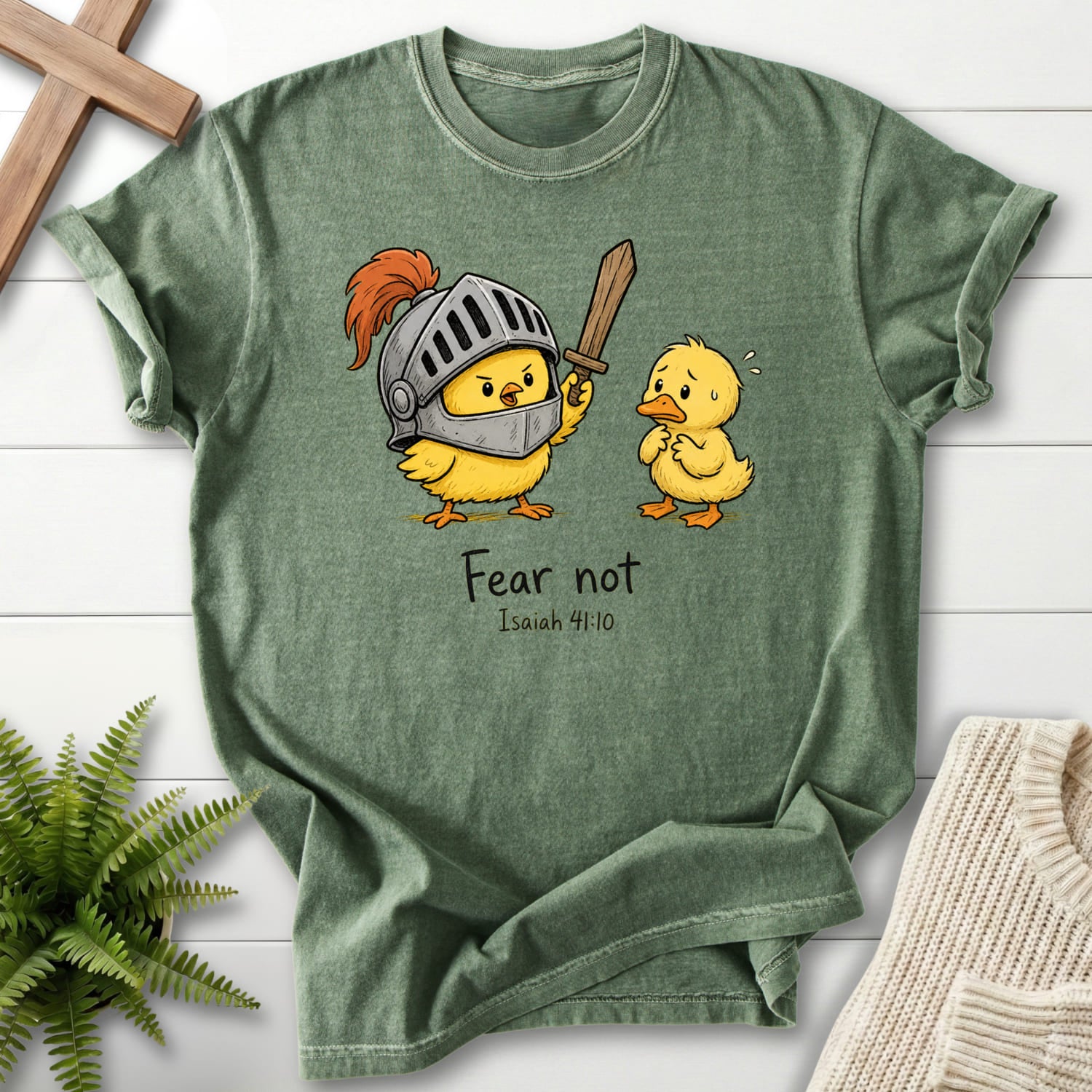 Flat lay of a Moss Comfort Colors 1717 Bible verse tee featuring "Fear Not Isaiah 41:10 Chick T-Shirt" Isaiah 41:10.
