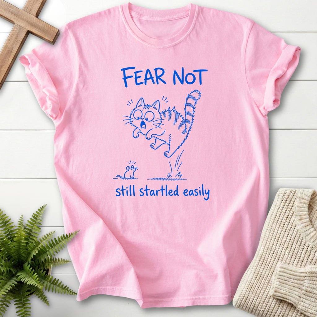 Flatlay of a Blossom Comfort Colors 1717 Christian t-shirt for women with "Fear Not Still Startled Easily T-Shirt" design.