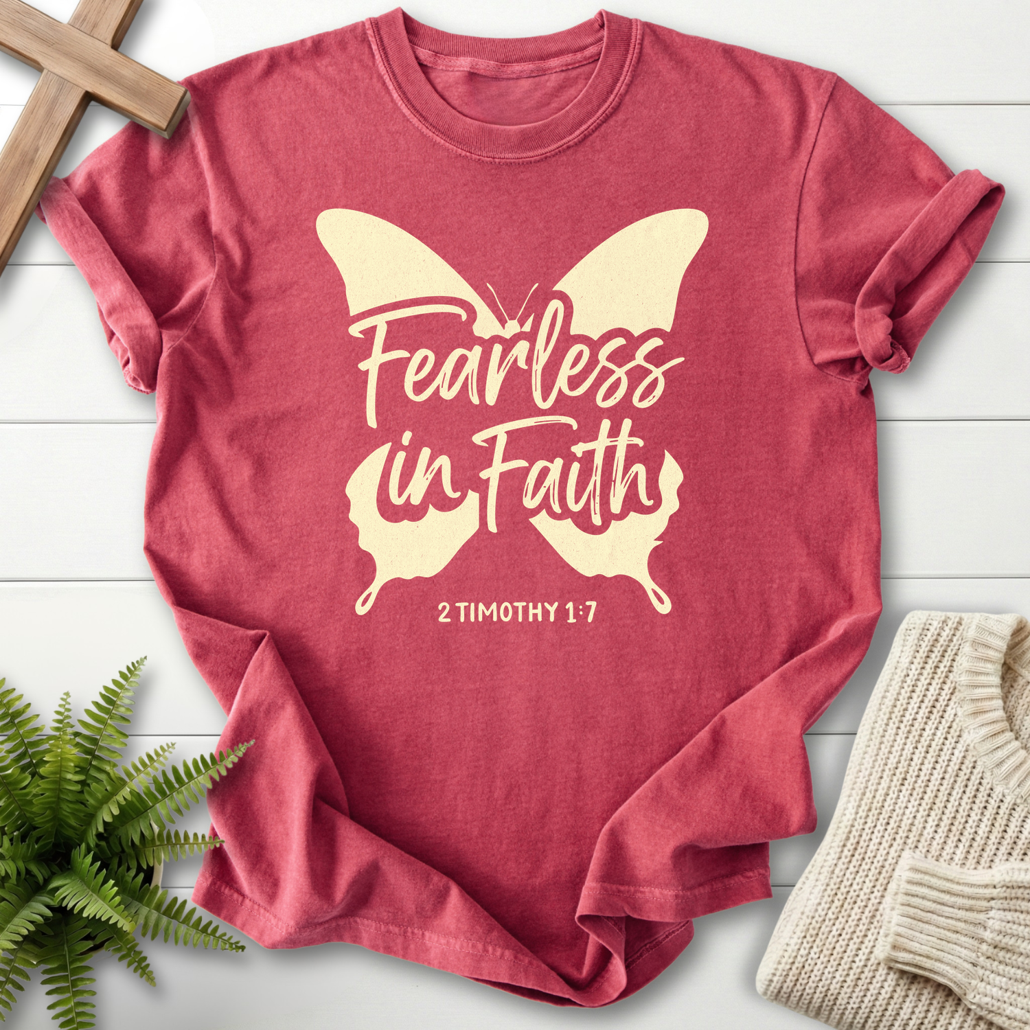 Crimson women's faith t-shirt with a butterfly silhouette and 'Fearless in Faith', 2 Timothy 1:7.