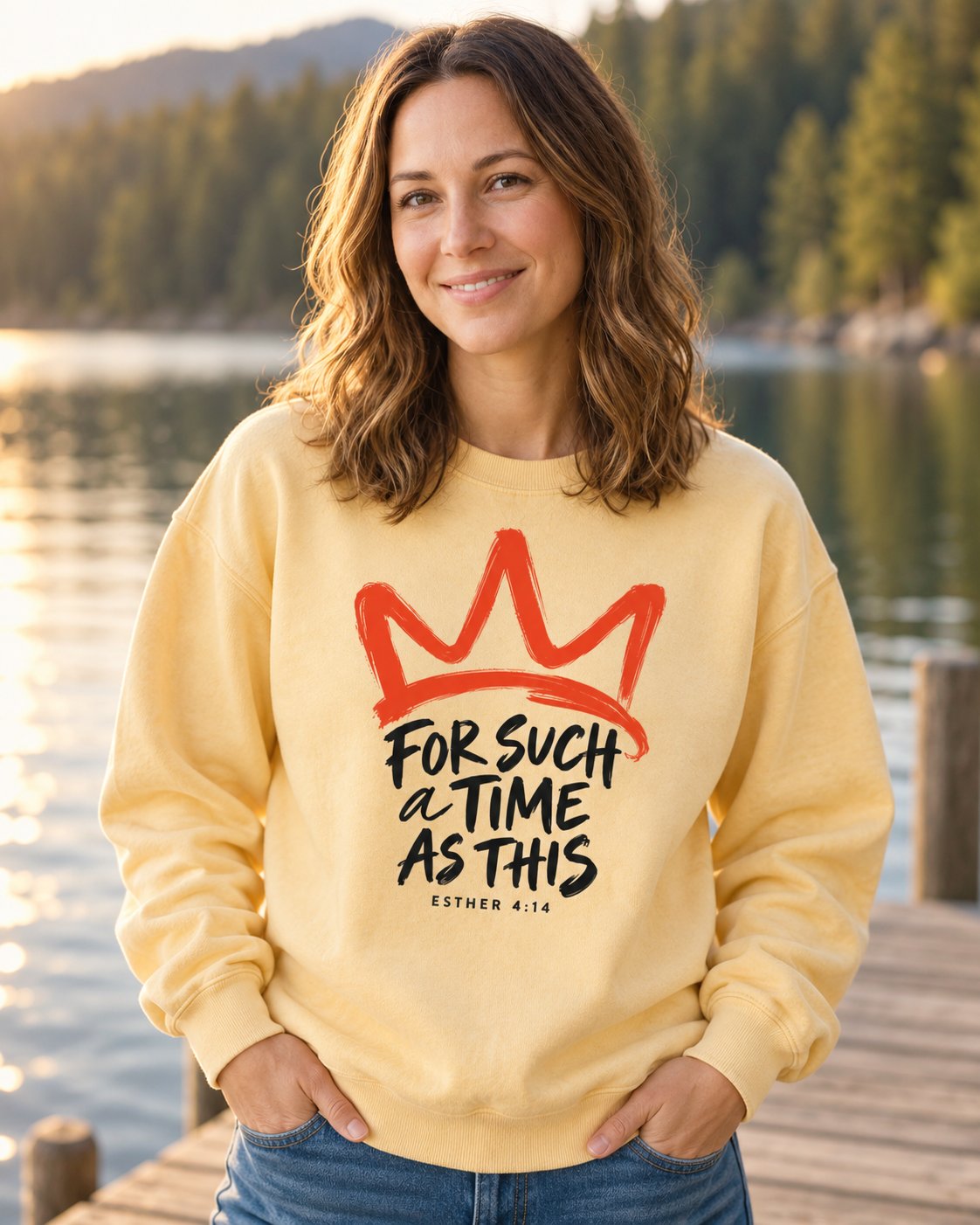 For Such a Time Crown, Butter women's Christian sweatshirt, lifestyle photo in lakeside setting, Brush painted crown above For Such a Time As This lettering, She Wears Faith