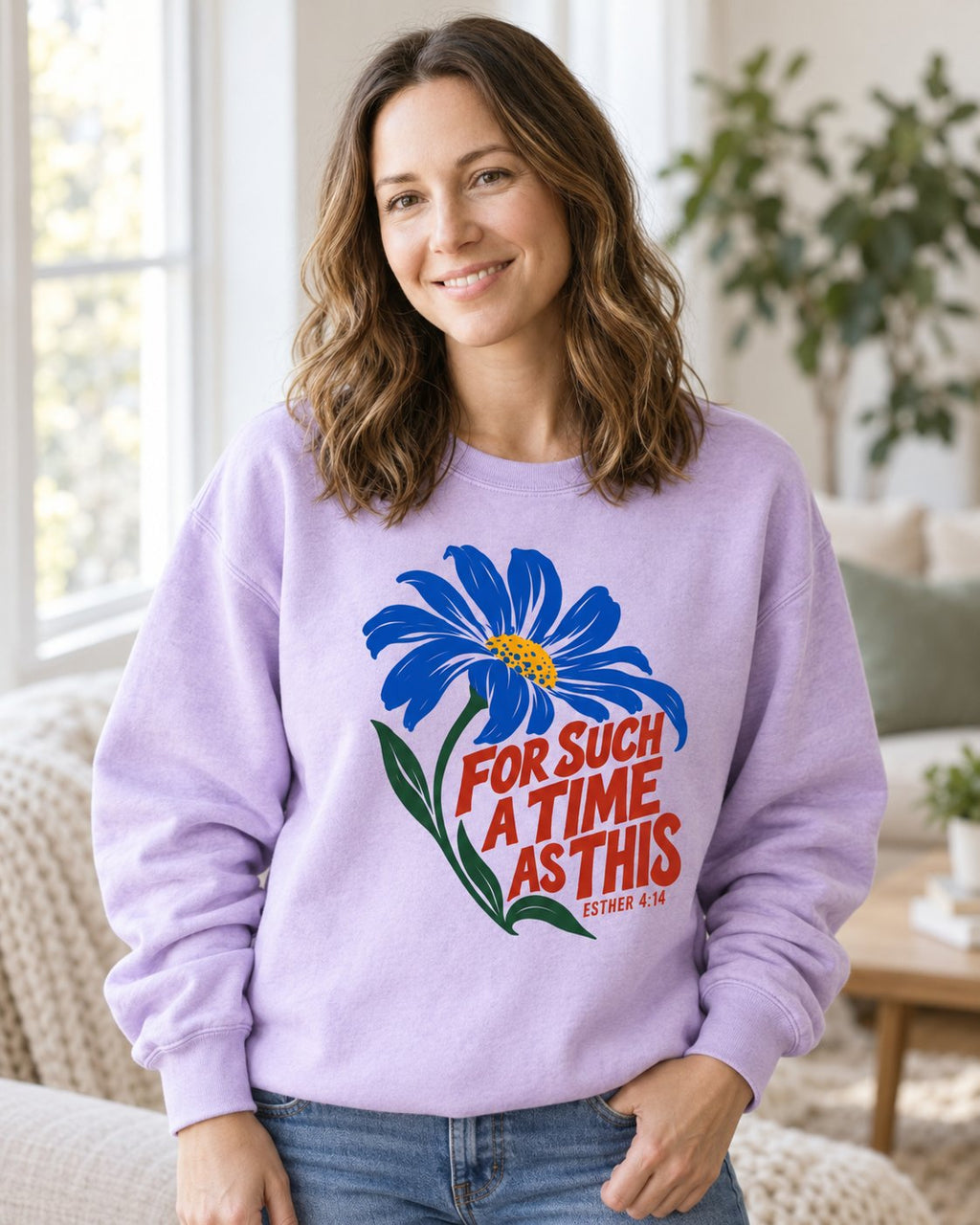 For Such a Time Daisy – Orchid women's Christian sweatshirt, lifestyle photo in cozy living room – Blue daisy with red hand-lettered For Such A Time As This – She Wears Faith