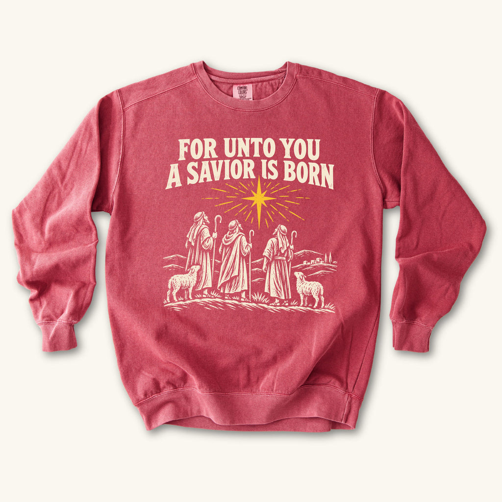 Crimson For Unto You a Savior Is Born sweatshirt flat lay mockup, Christian apparel for women