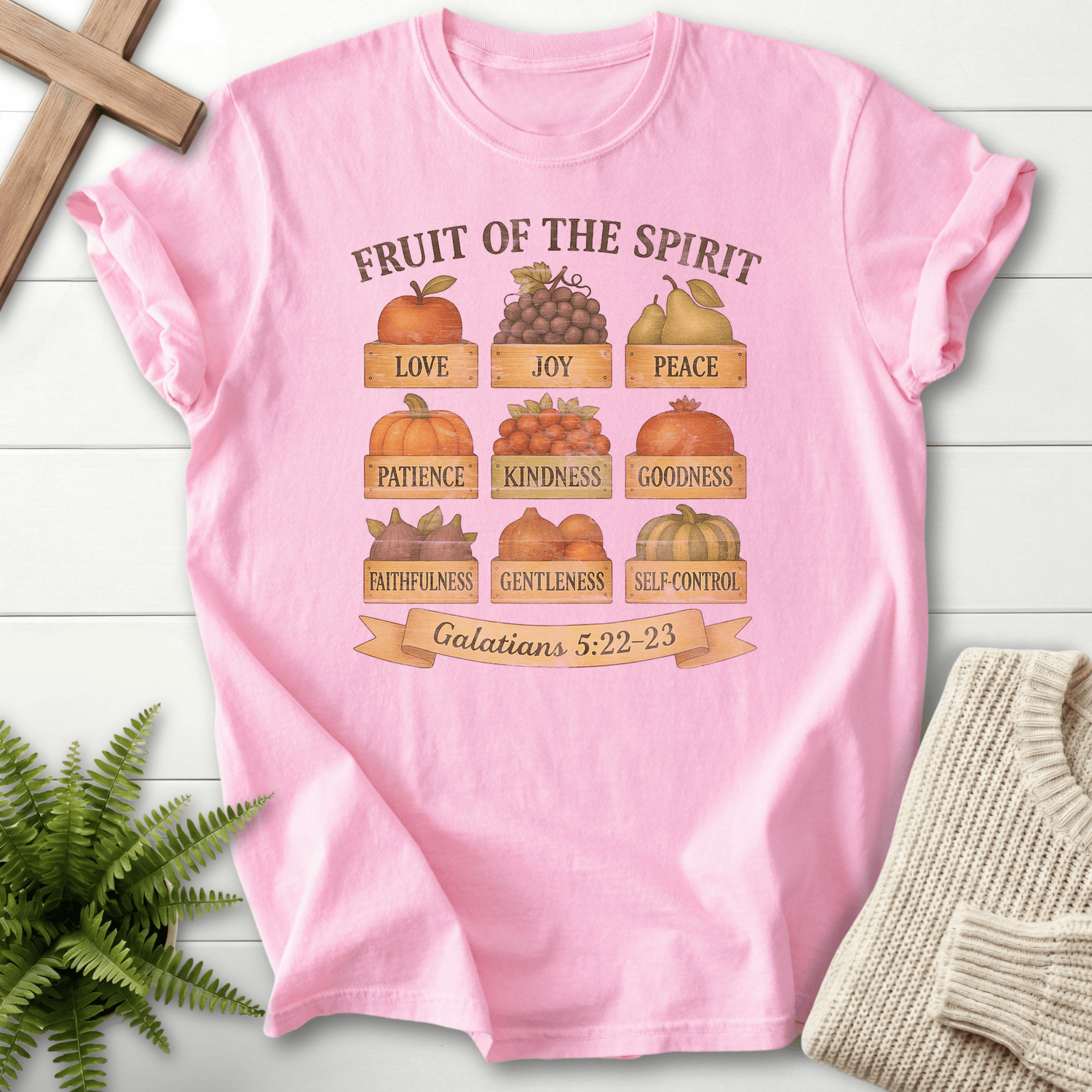 Blossom women's faith t-shirt with pumpkins, grapes, and other fall produce arranged in a Fruit of the Spirit grid.